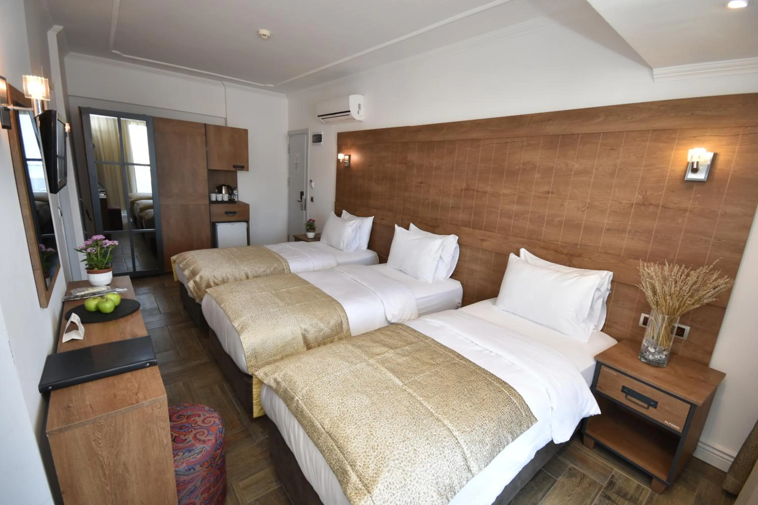 Bed in Aurasia Beach Hotel