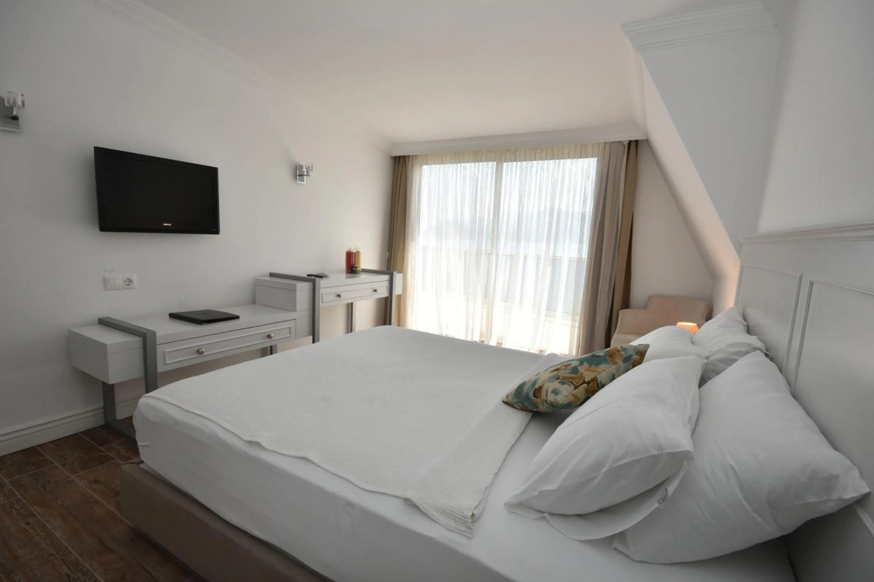 Bed in Aurasia Beach Hotel