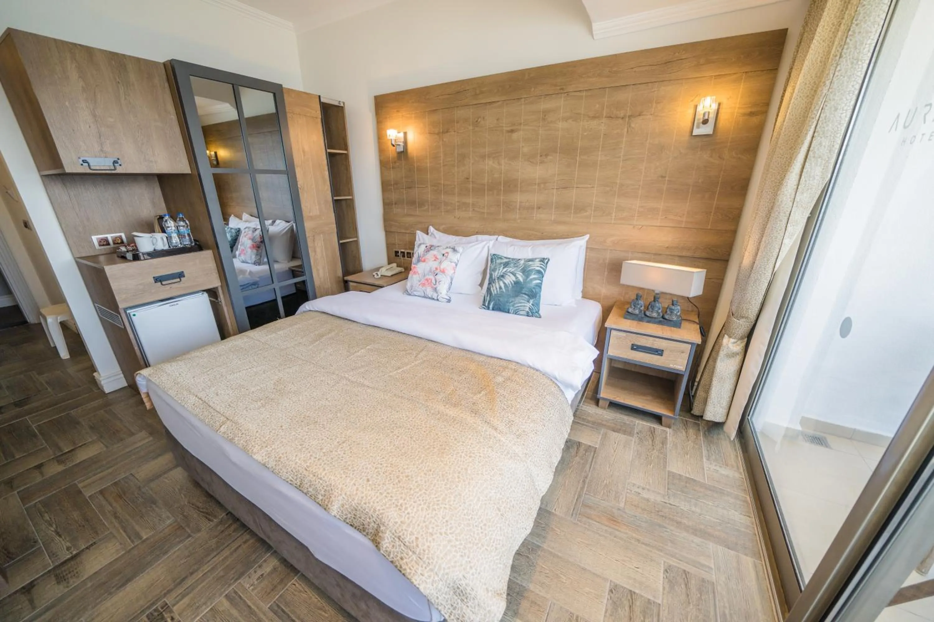 Bed in Aurasia Beach Hotel