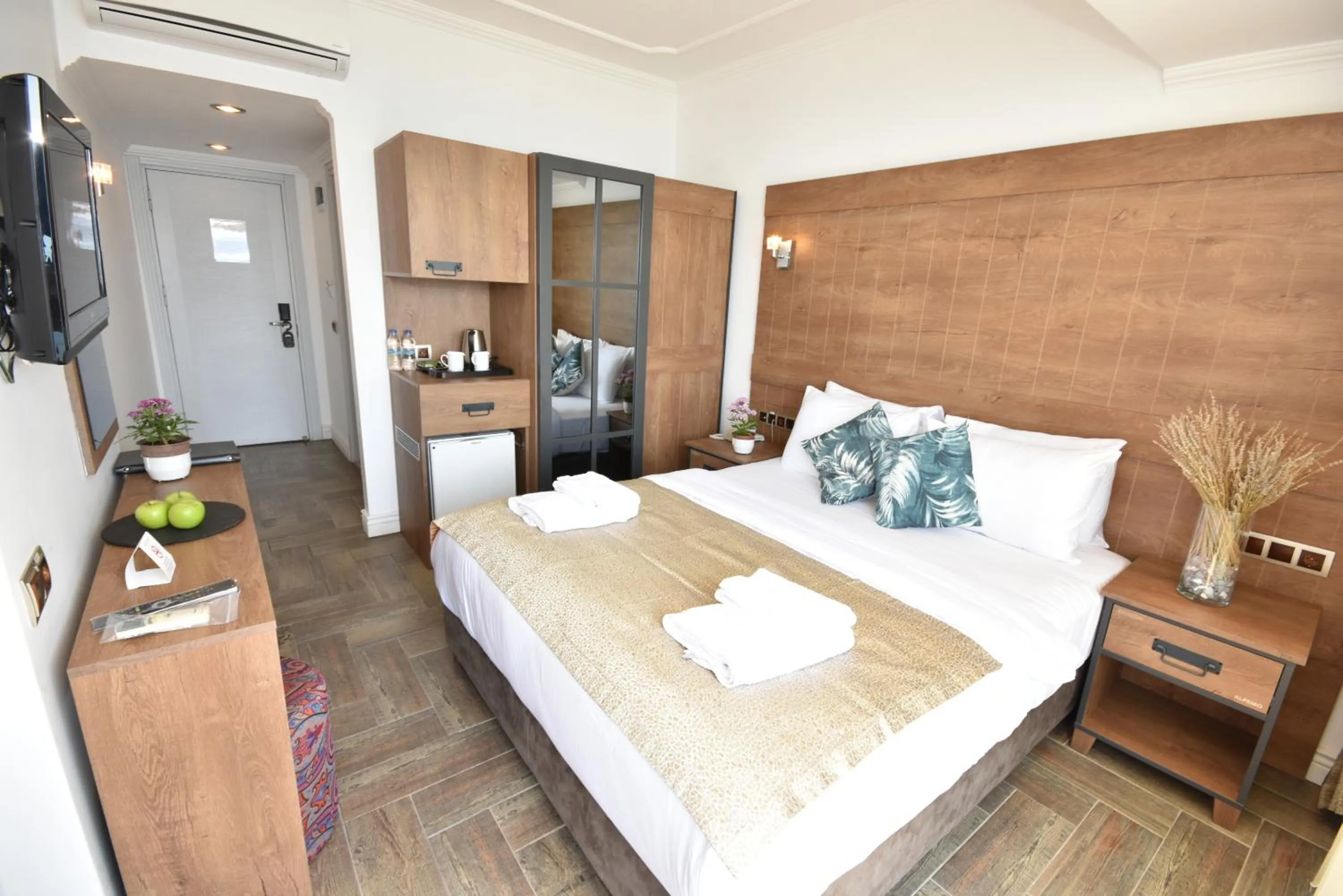 Bed in Aurasia Beach Hotel