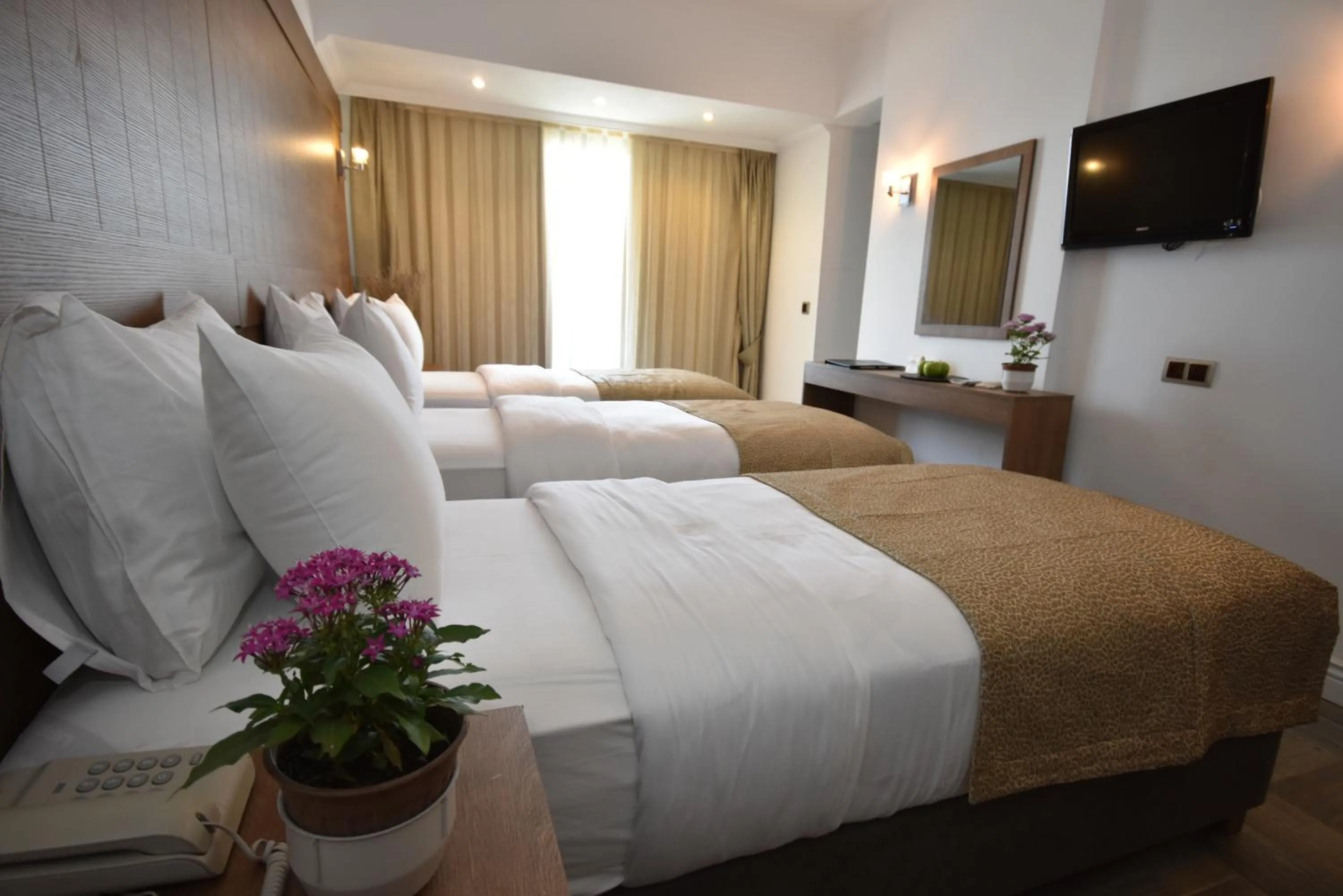 Bed in Aurasia Beach Hotel