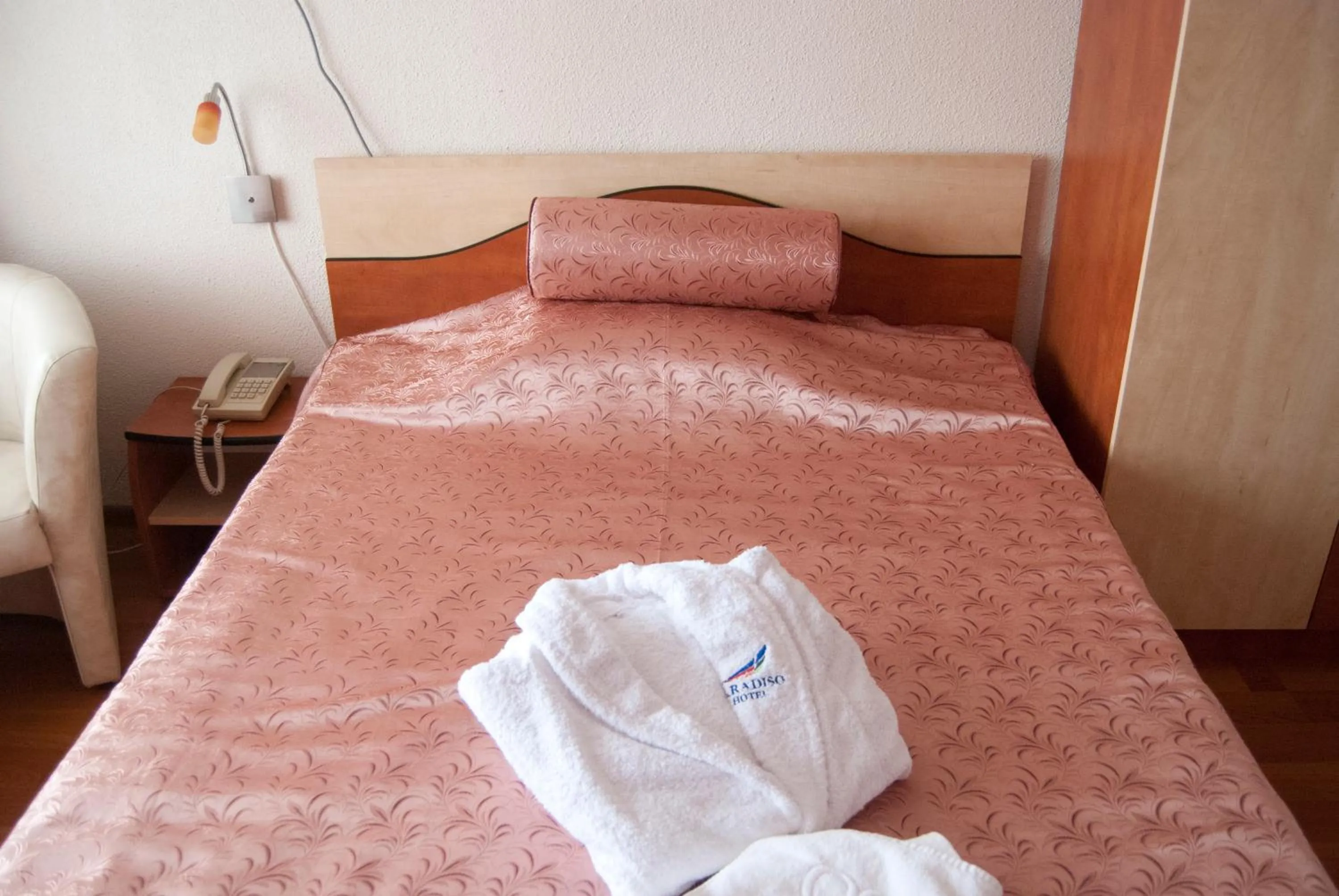 Bed in Hotel Paradiso
