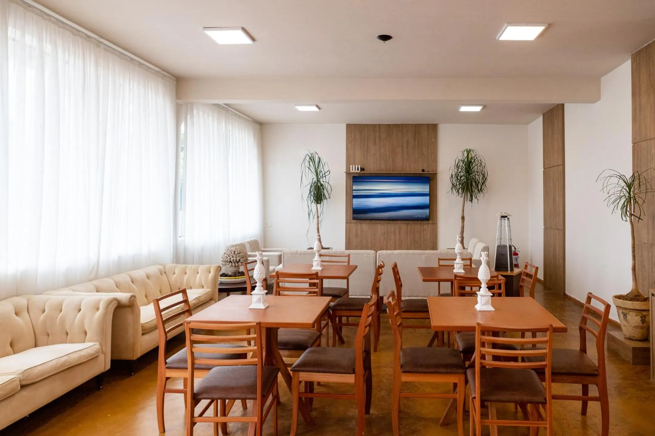 Communal lounge/ TV room in Pousada de Charme Vila Natal