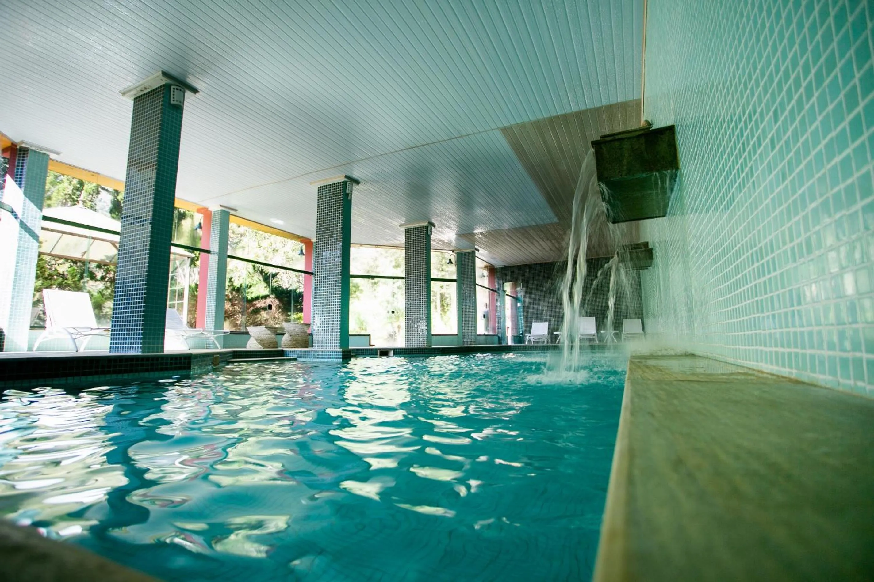 Swimming pool in Bomtempo II Chales by Castelo Itaipava