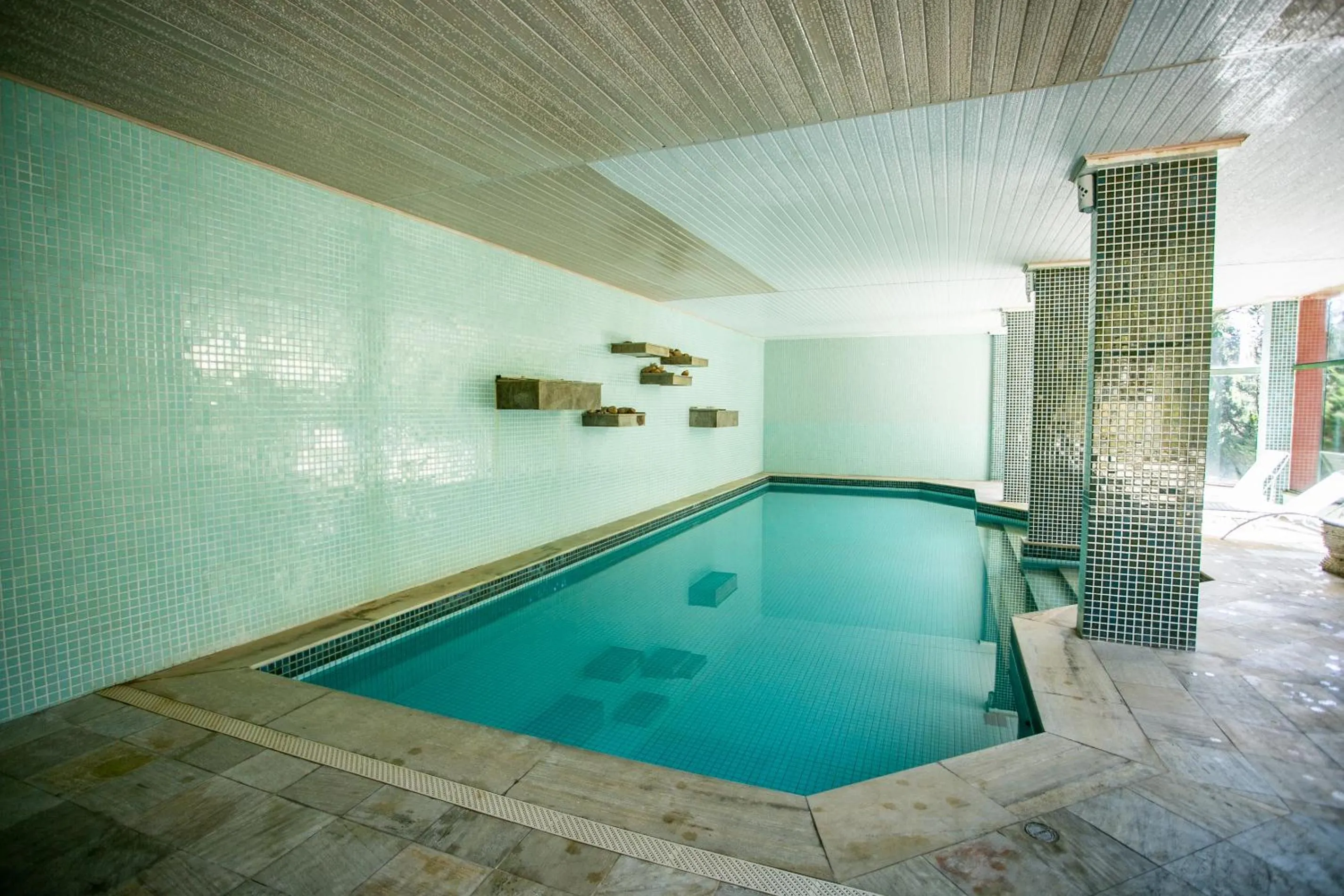 Swimming pool in Bomtempo II Chales by Castelo Itaipava