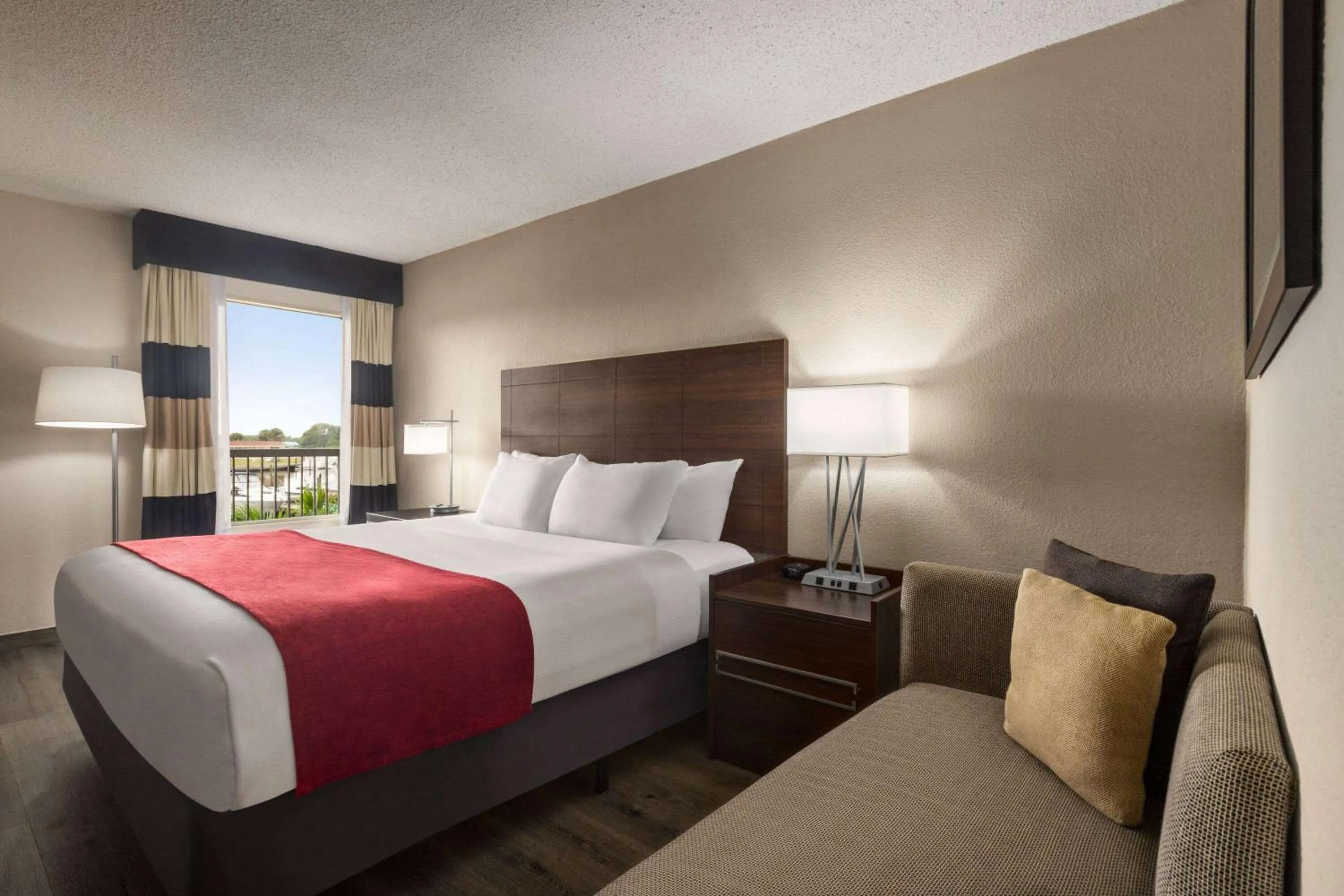 Photo of the whole room, Bed in Ramada by Wyndham Sarasota Waterfront