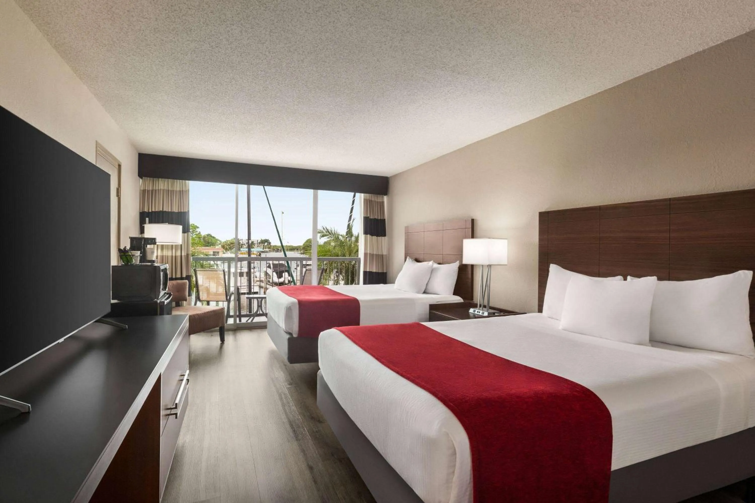 Photo of the whole room, Bed in Ramada by Wyndham Sarasota Waterfront