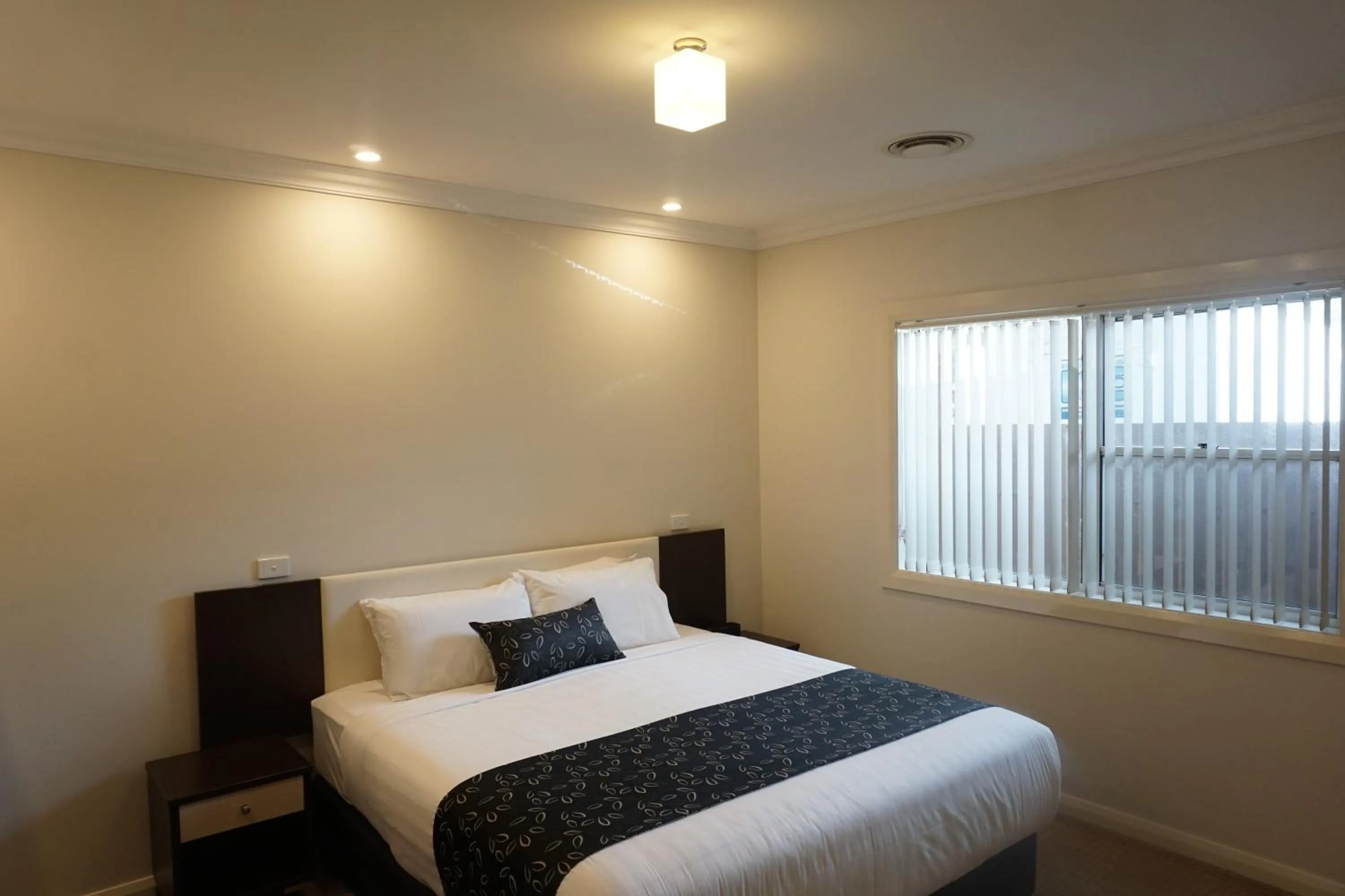Bed in Charles Sturt Suites & Apartments