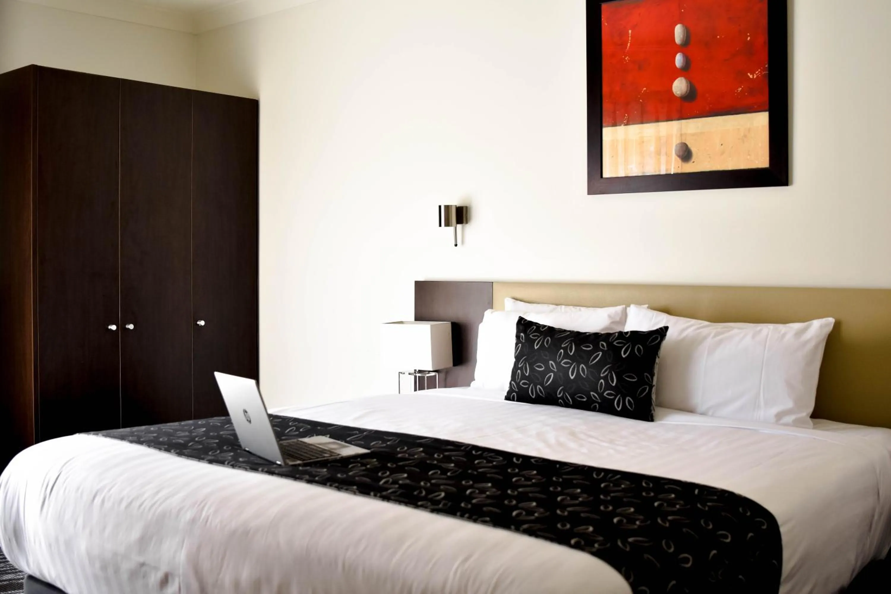 Bed in Charles Sturt Suites & Apartments