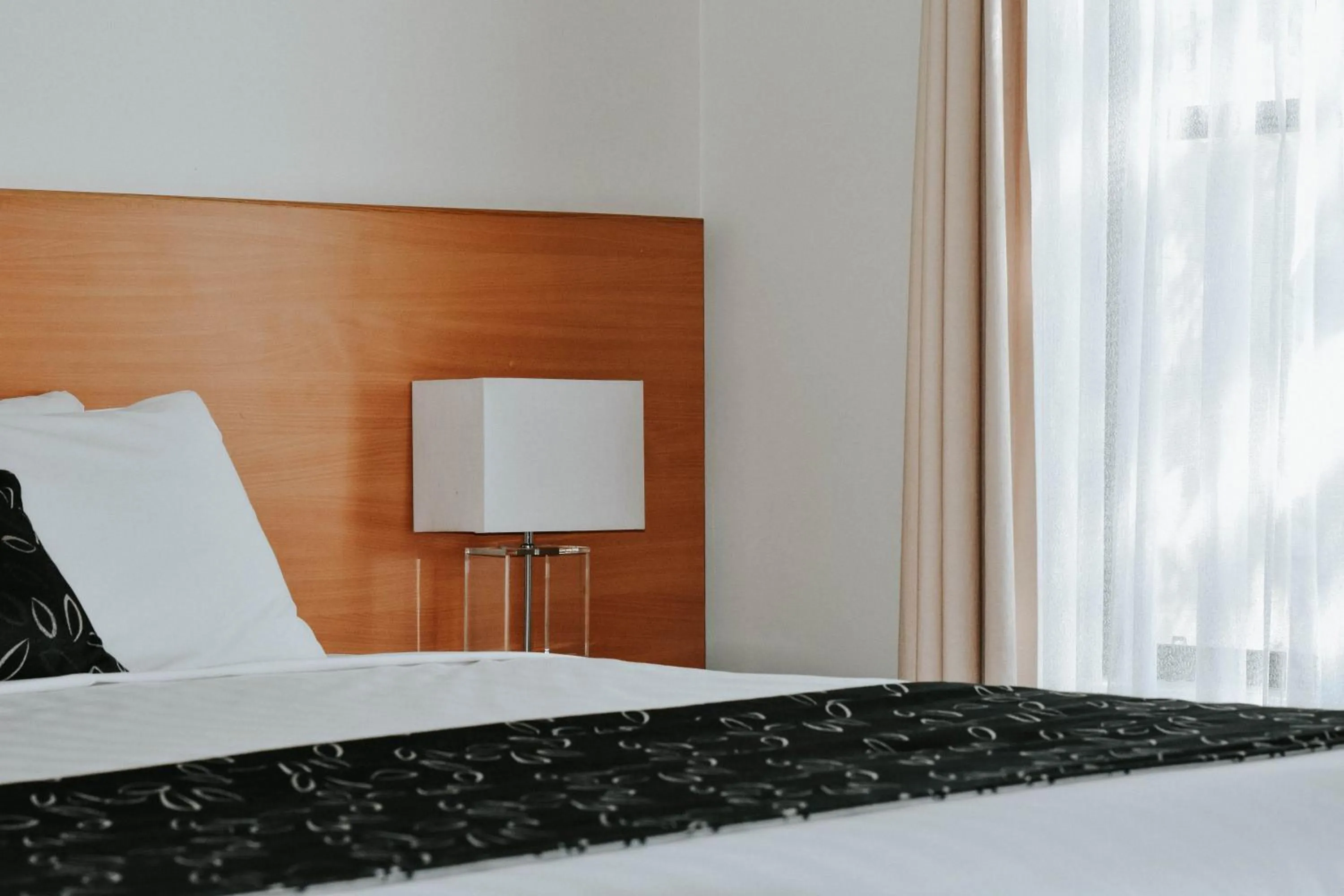 Bedroom, Bed in Charles Sturt Suites & Apartments