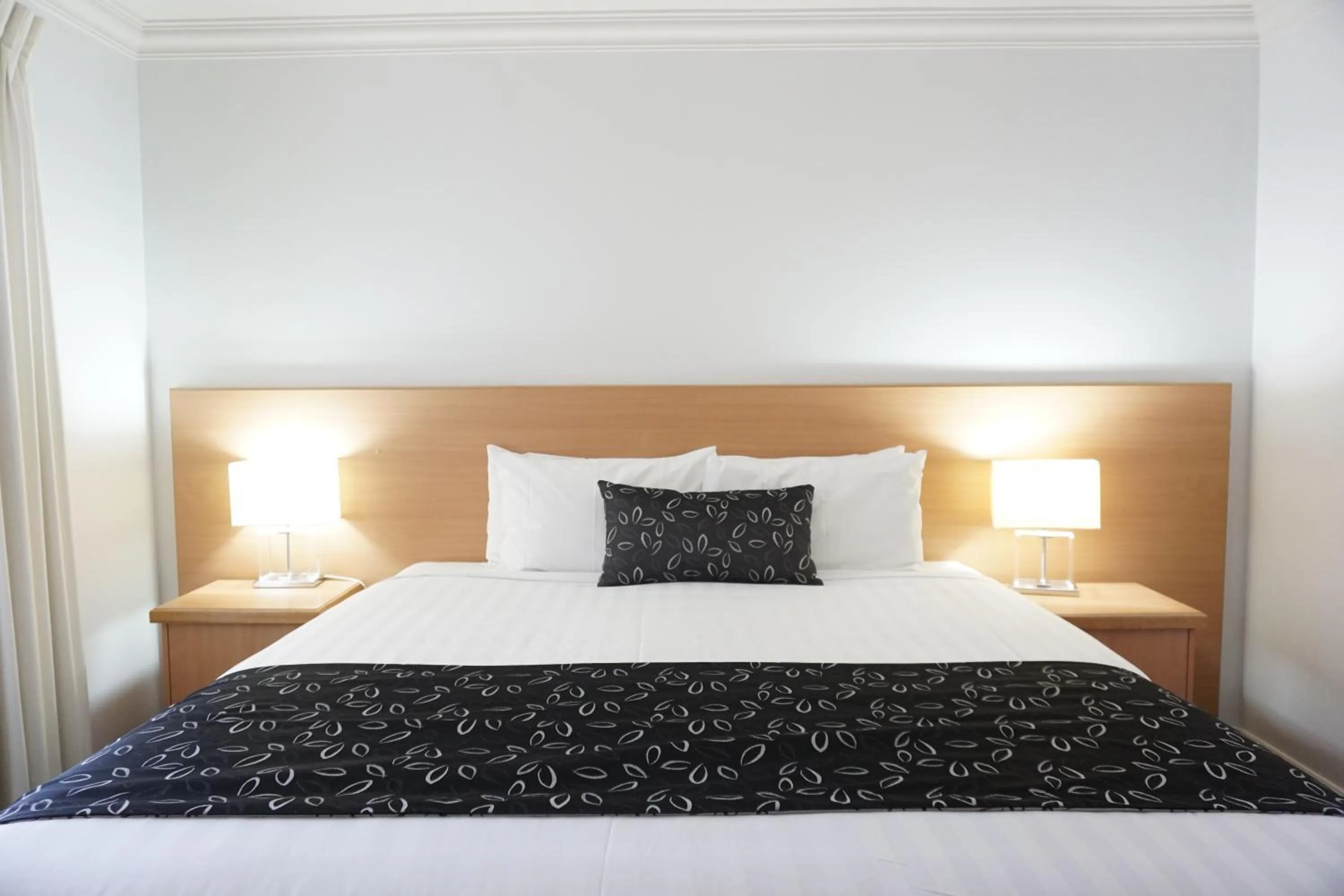 Bed in Charles Sturt Suites & Apartments