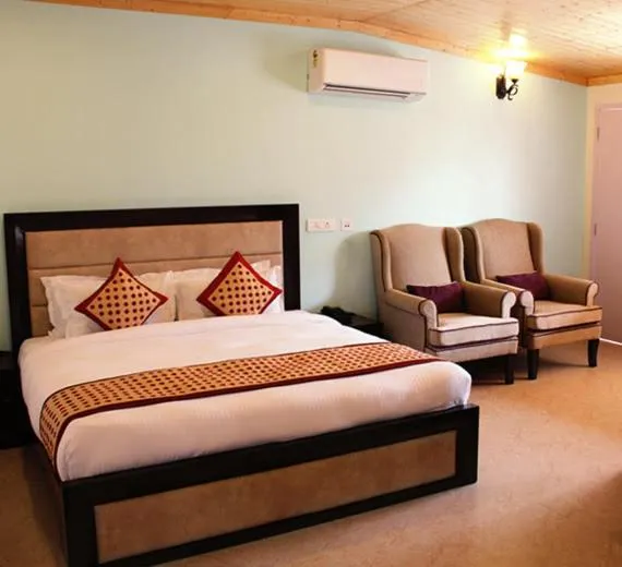 Bed in Four Banyans Spirit & Nature Resort