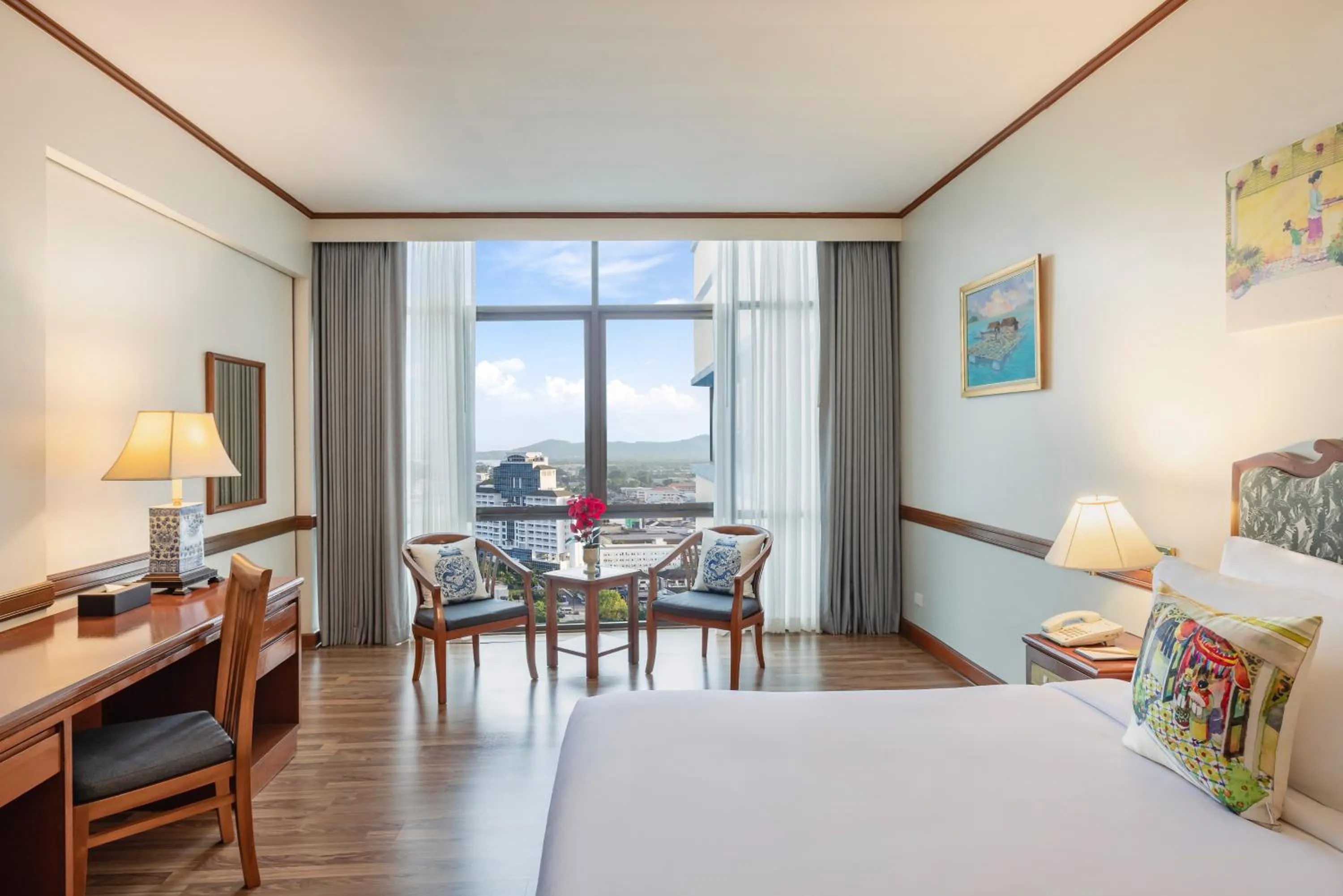 Living room, Bed in Royal Phuket City Hotel