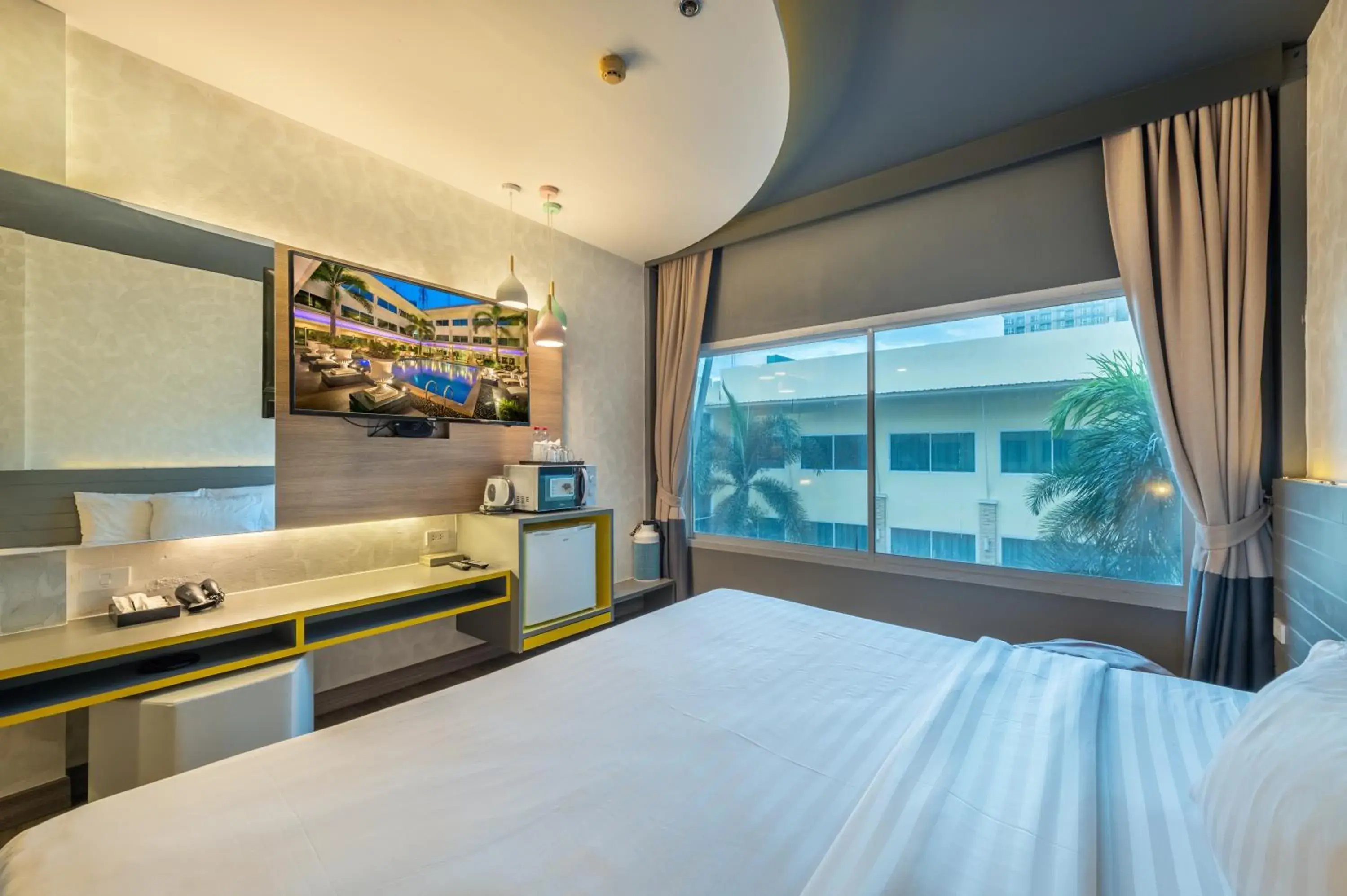 Bed in Qiu Hotel Sukhumvit - BTS On Nut Station Bed in Qiu Hotel Sukhumvit - BTS On Nut Station
