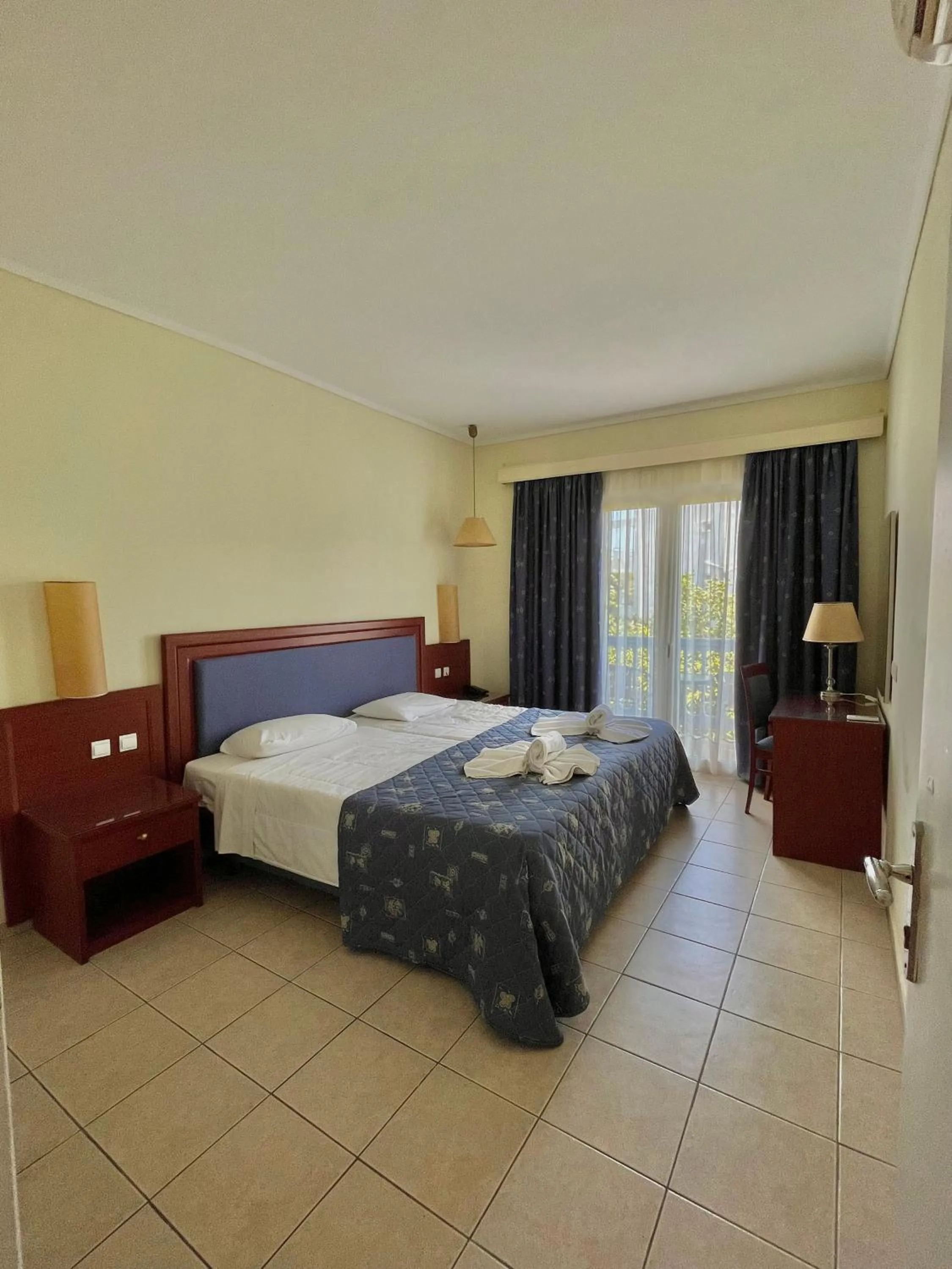 Bed in Theodorou Beach Hotel Apartments