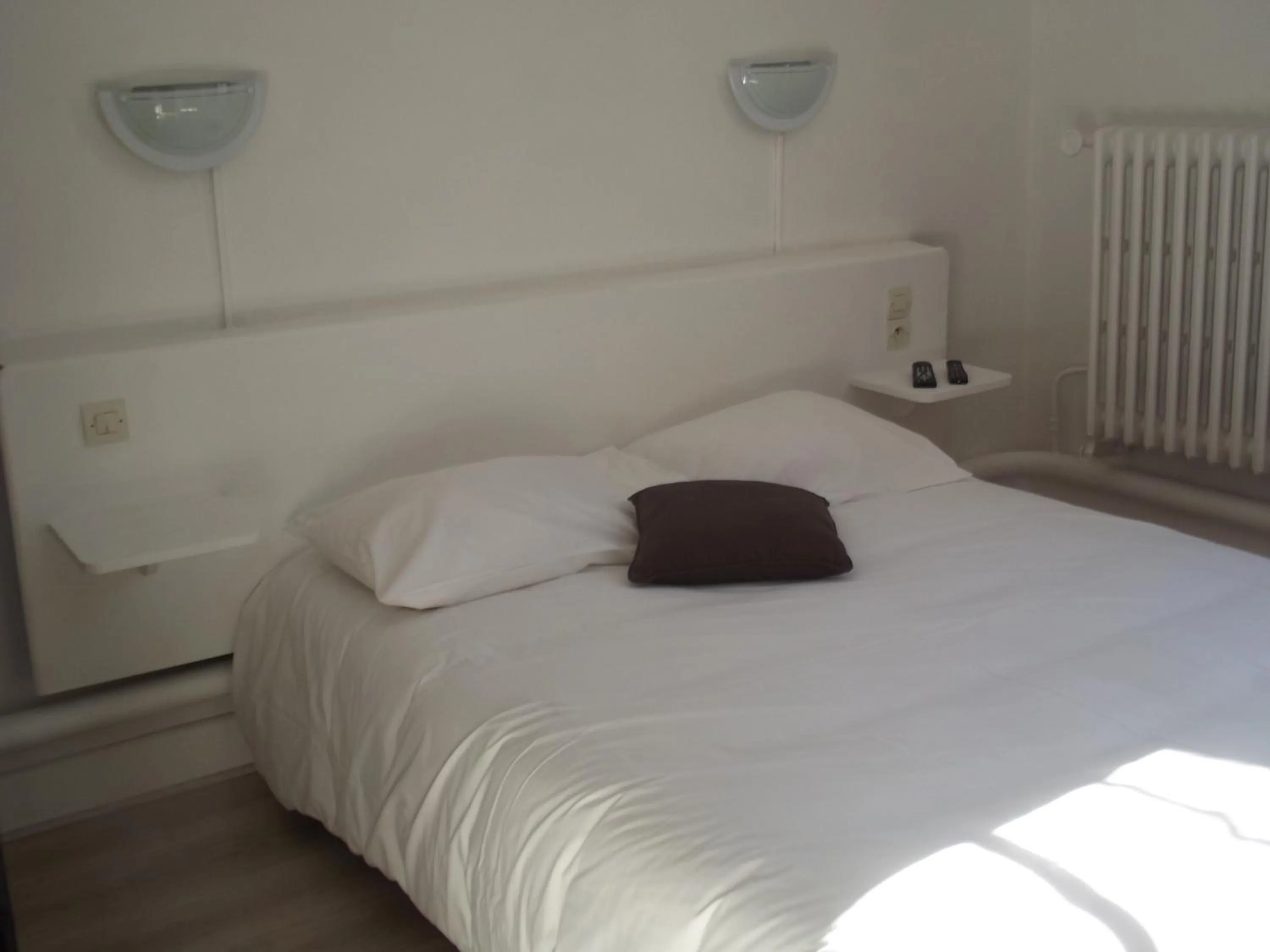 Bed in Hotel De La Poste