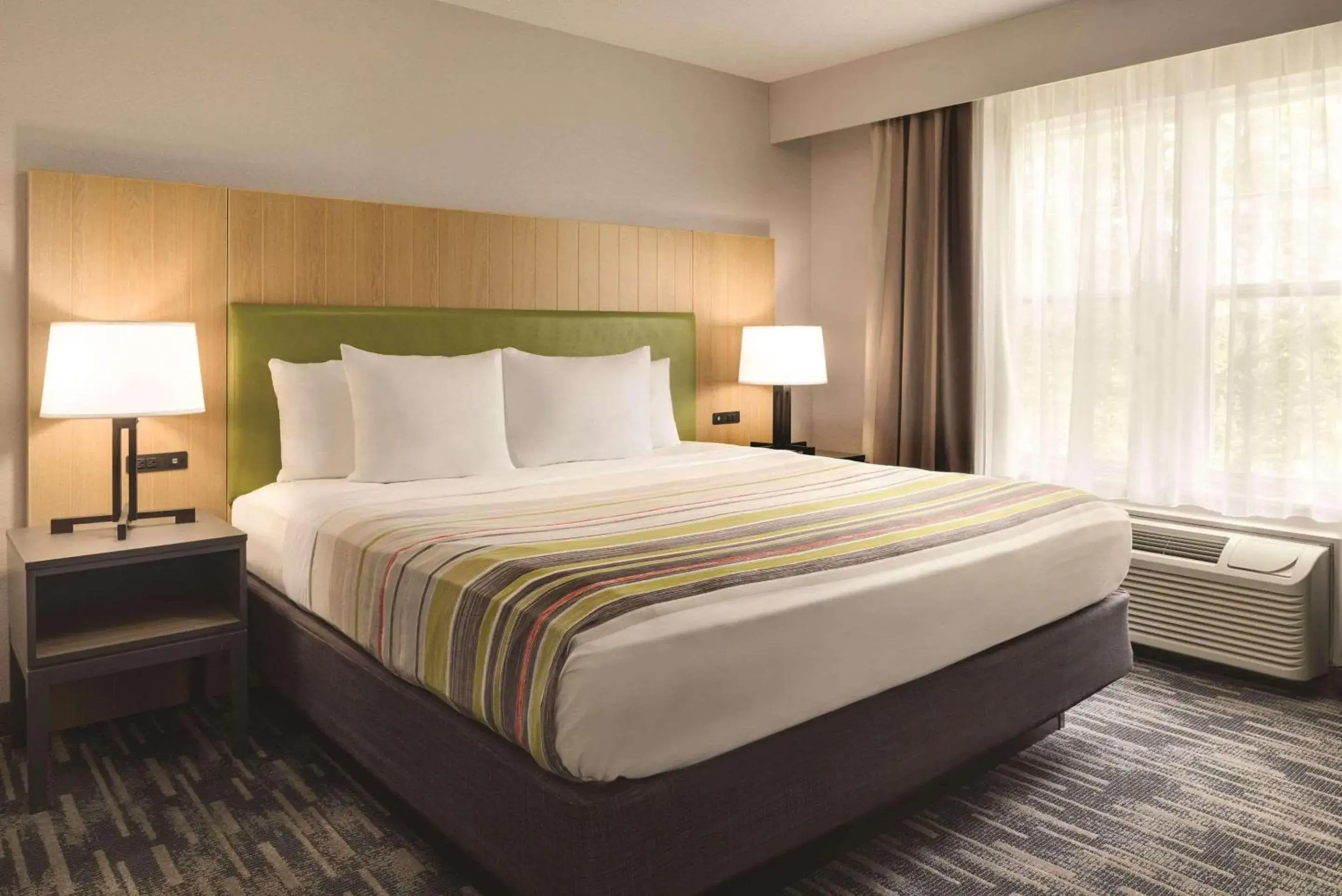 Bedroom, Bed in Country Inn & Suites by Radisson, Pella, IA Bedroom, Bed in Country Inn & Suites by Radisson, Pella, IA