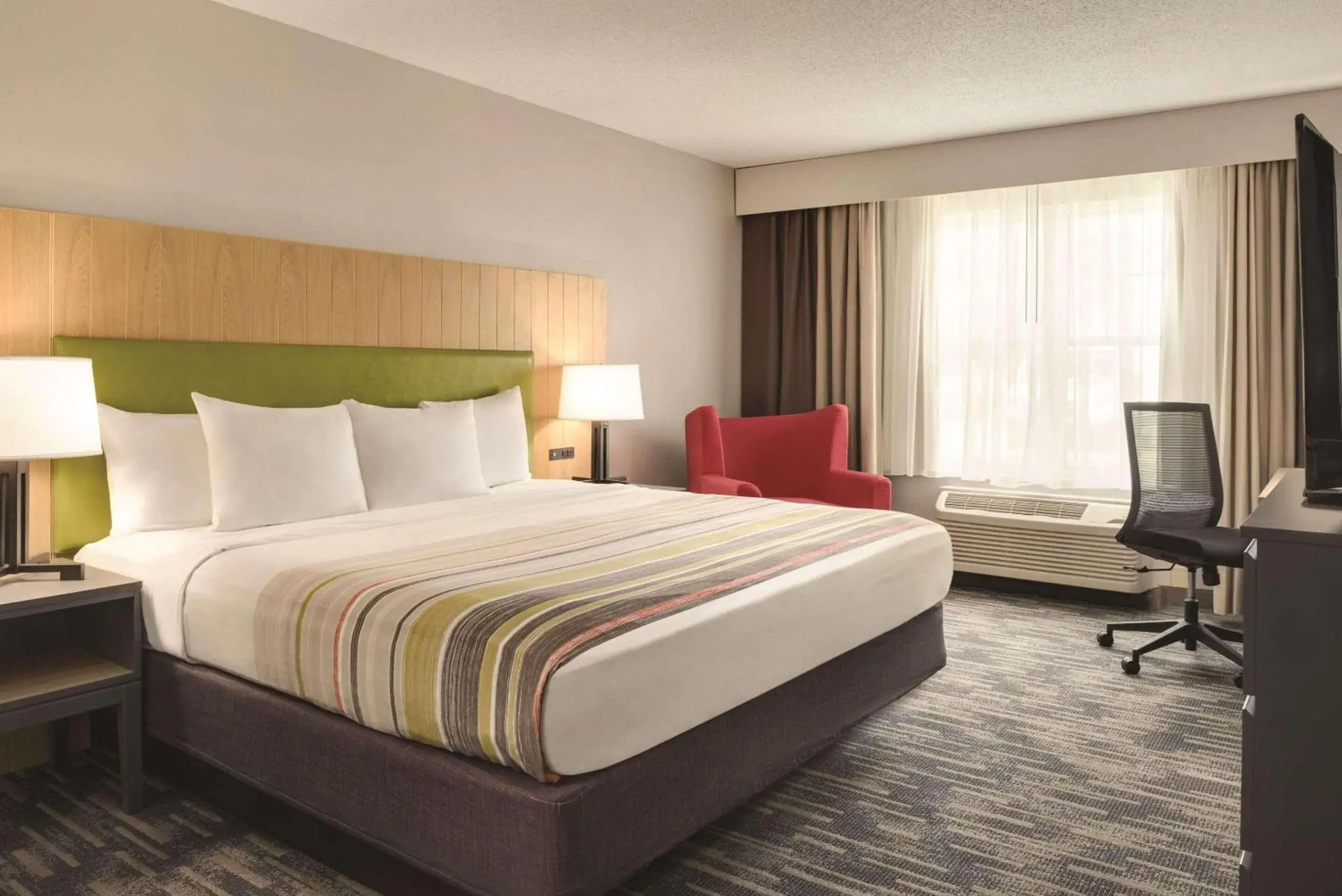 Bedroom, Bed in Country Inn & Suites by Radisson, Pella, IA Bedroom, Bed in Country Inn & Suites by Radisson, Pella, IA
