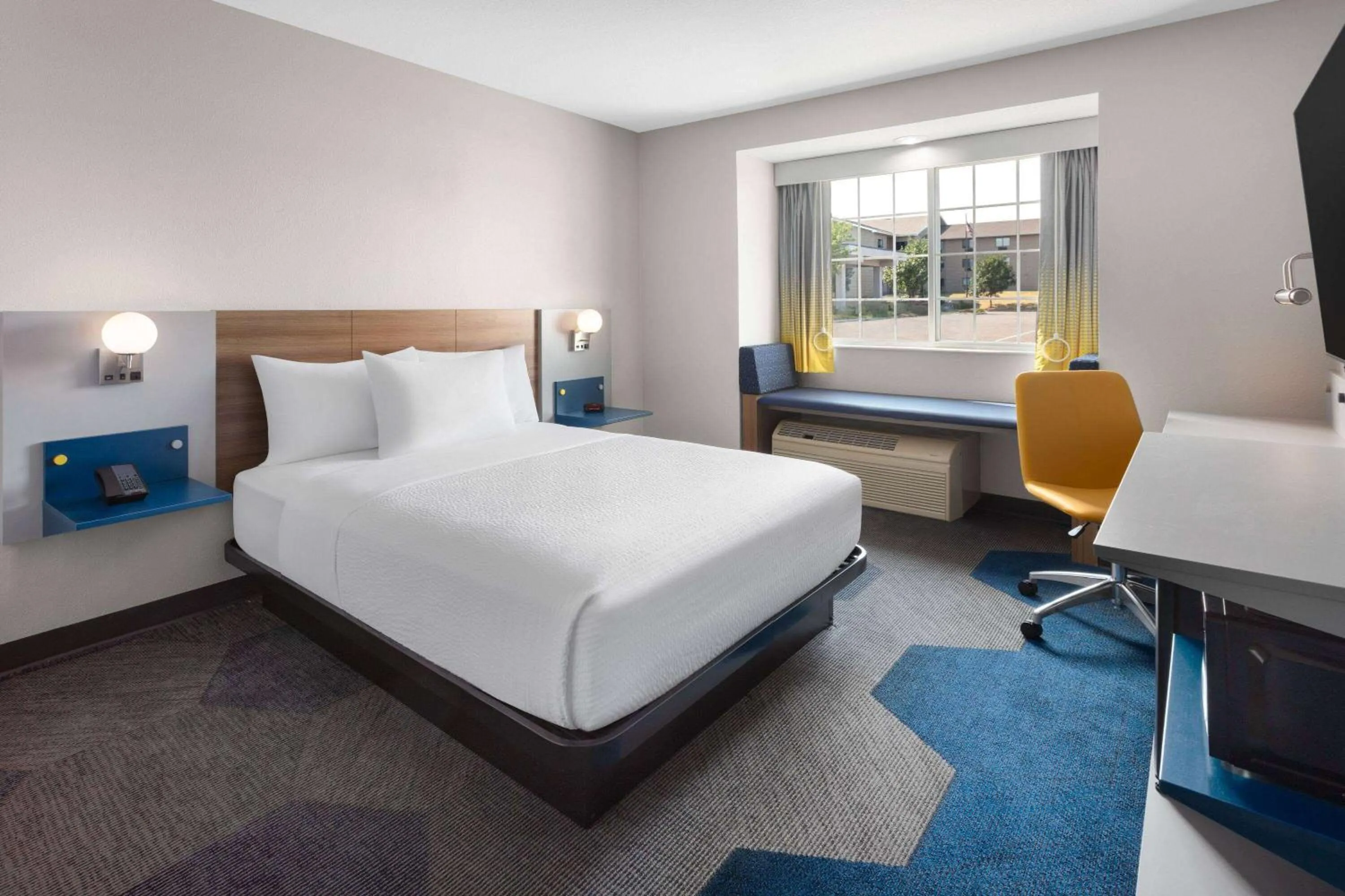 Photo of the whole room, Bed in Microtel Inn & Suites by Wyndham Rapid City
