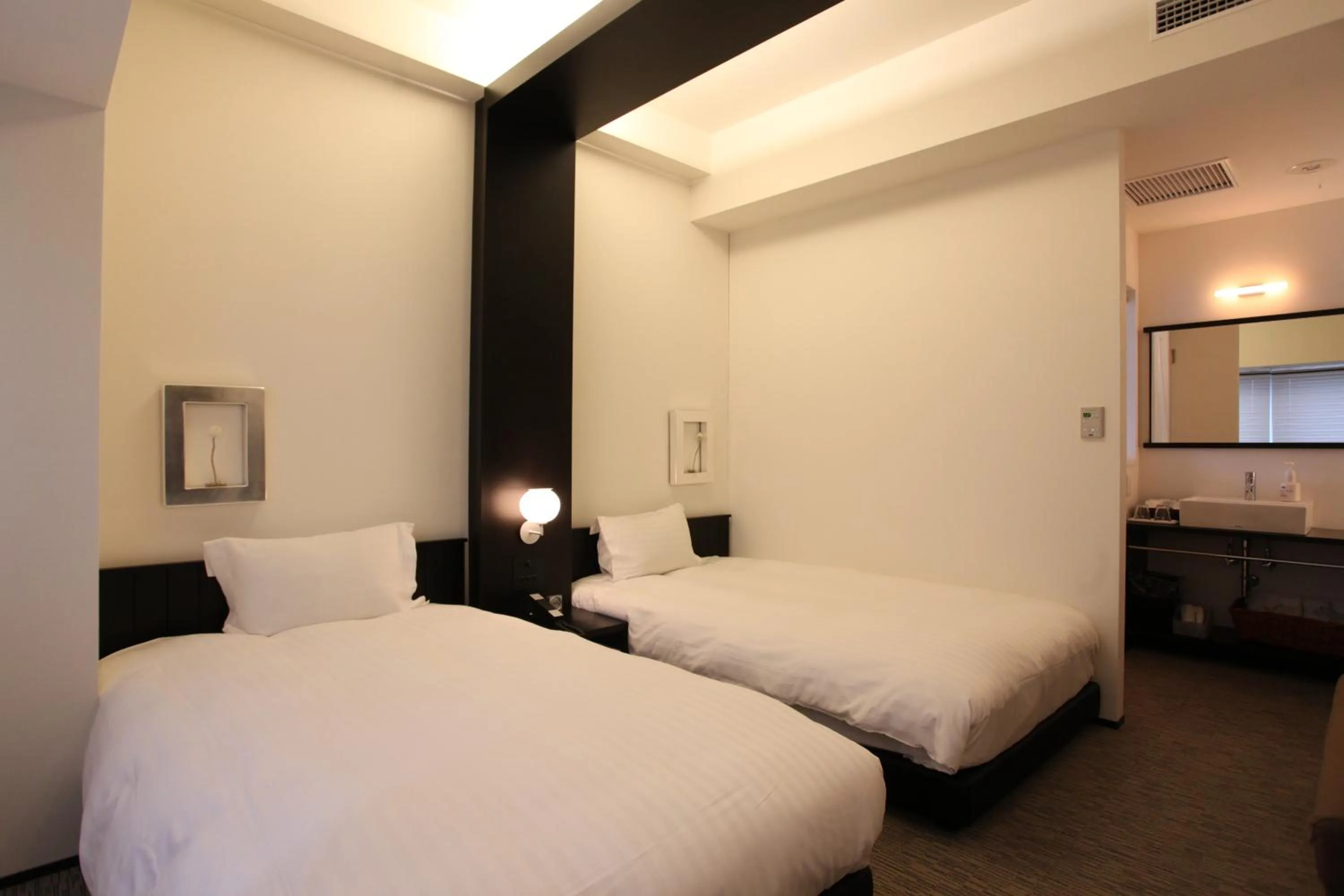 Bed in Furano Natulux Hotel