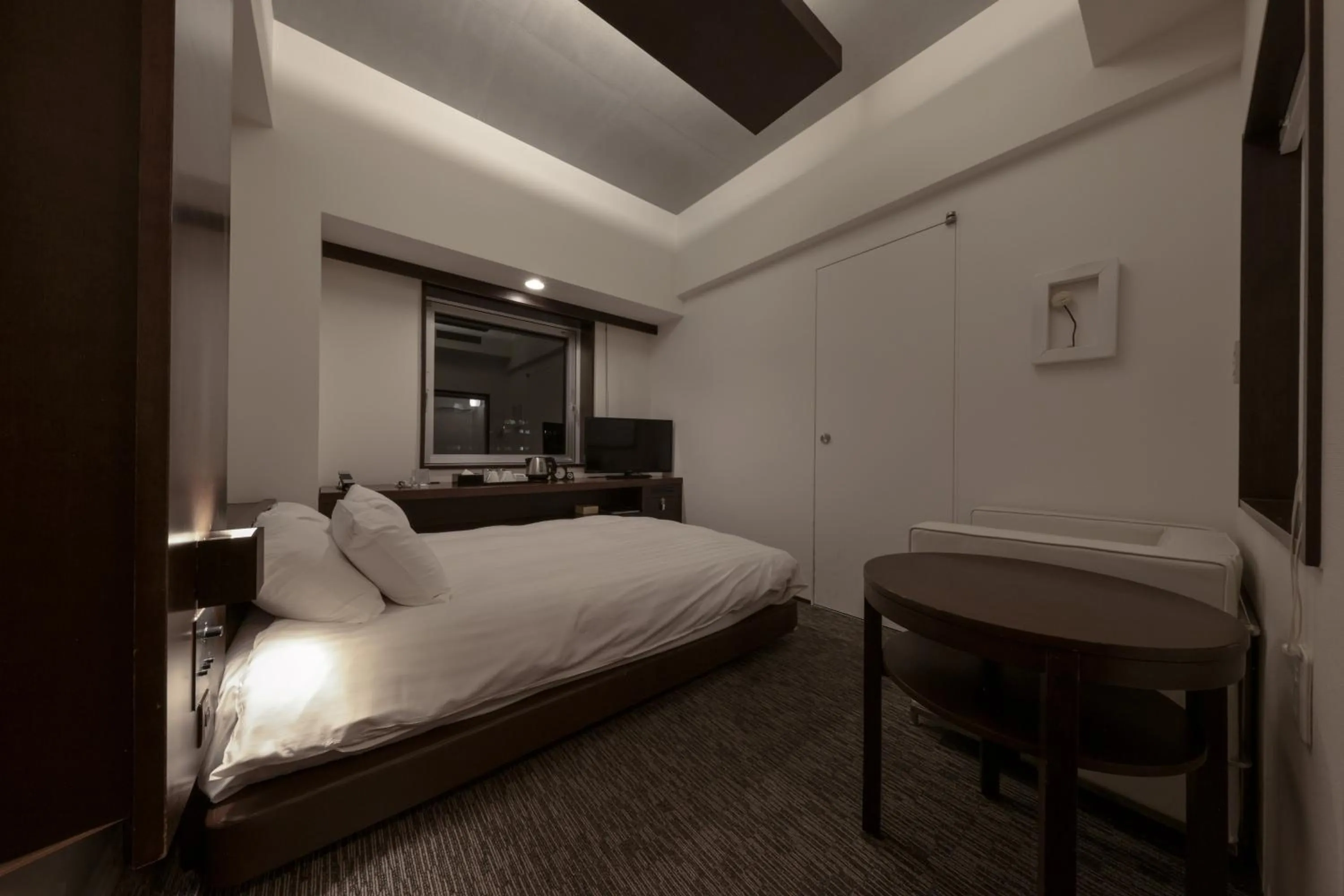 Bed in Furano Natulux Hotel