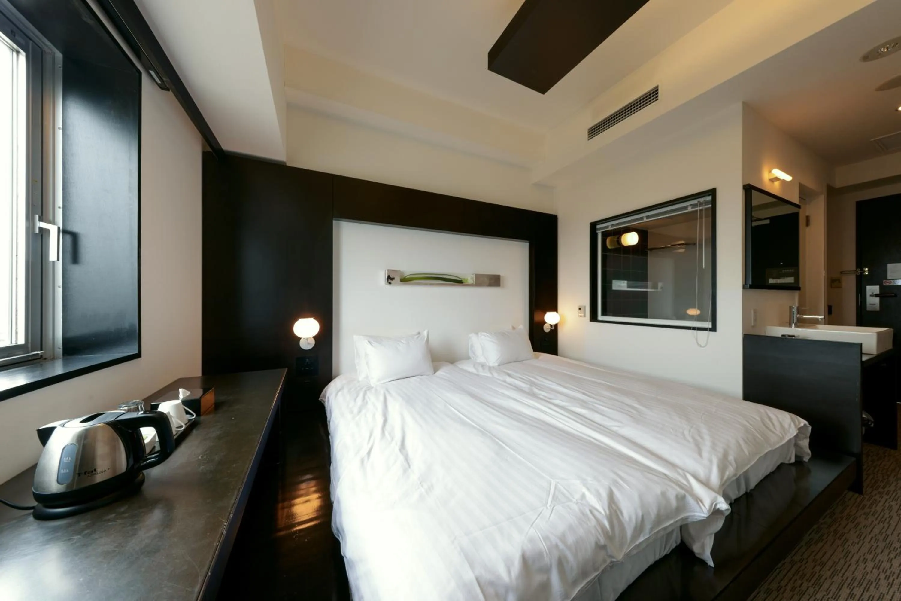 Bed in Furano Natulux Hotel