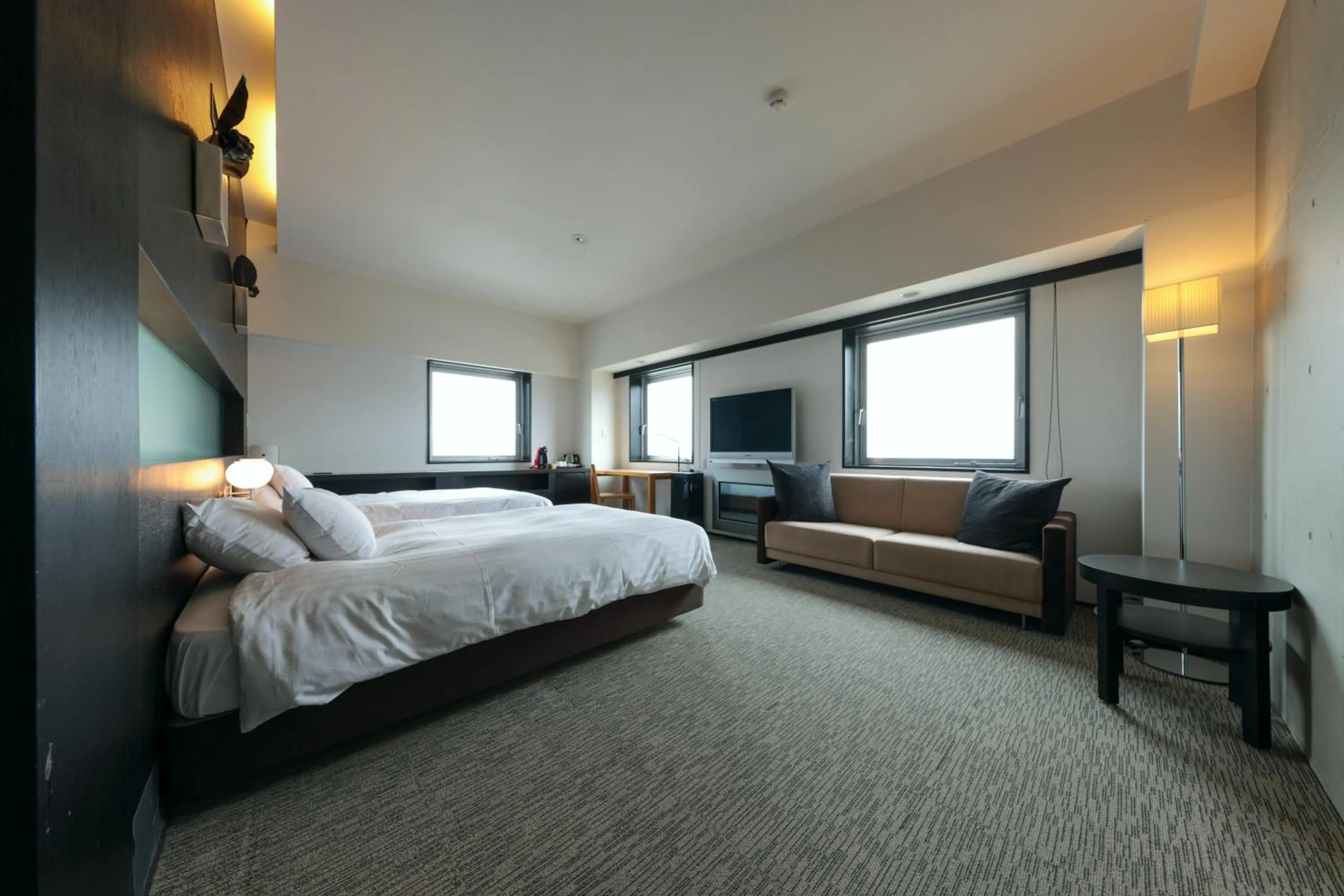 Bed in Furano Natulux Hotel