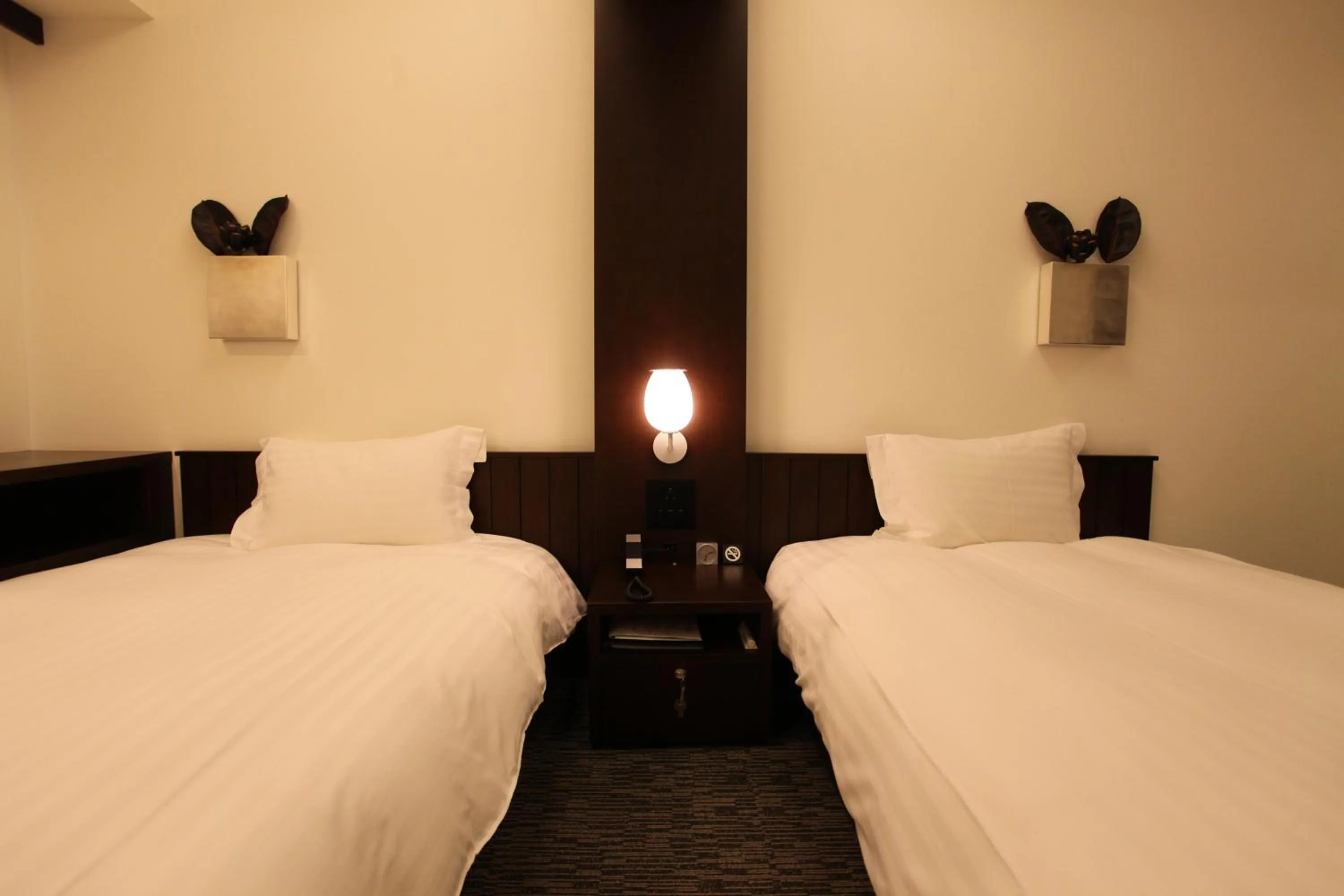 Bed in Furano Natulux Hotel