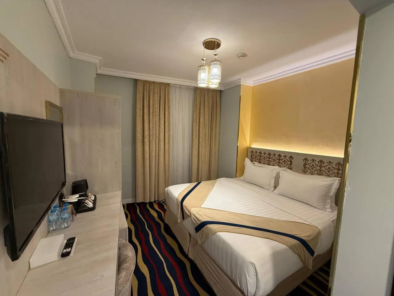 Communal lounge/ TV room, Bed in Dar Al Naem Hotel