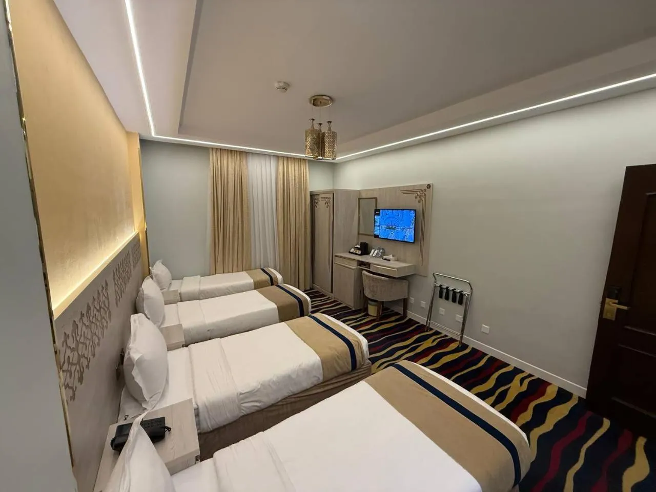 Communal lounge/ TV room, Bed in Dar Al Naem Hotel