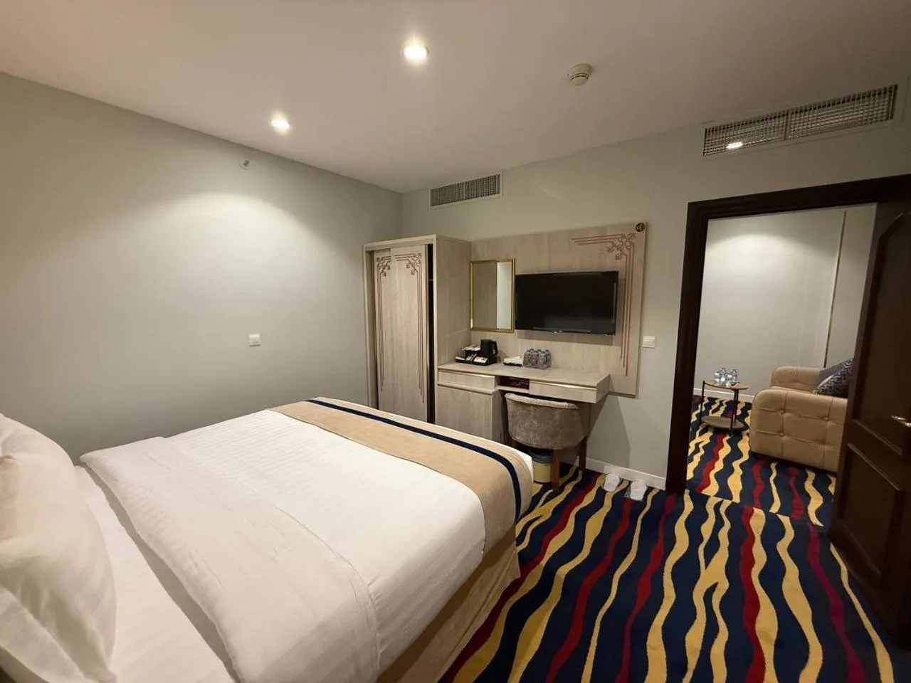 Communal lounge/ TV room, Bed in Dar Al Naem Hotel