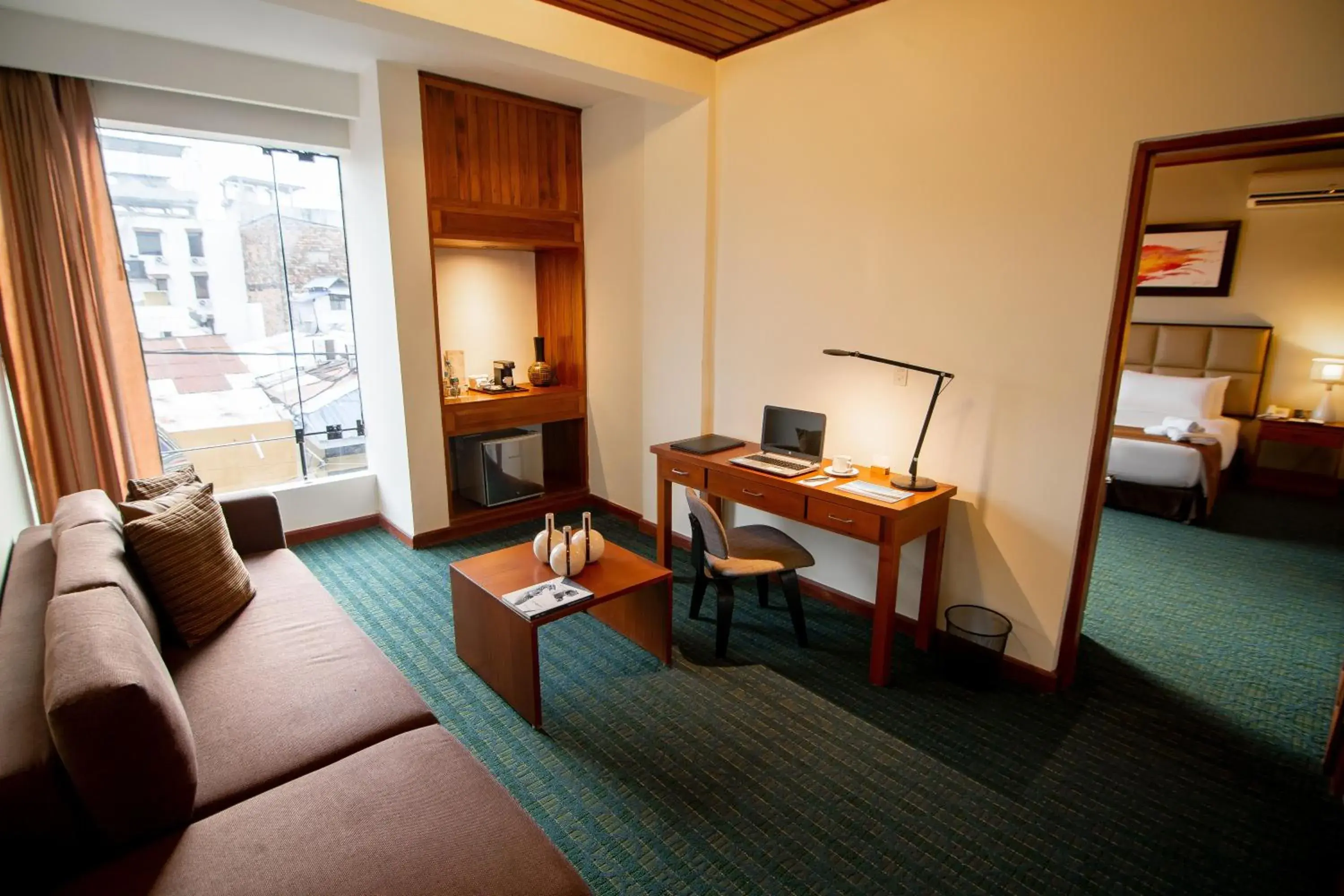 Seating area, Bed in El Dorado Classic Hotel Seating area, Bed in El Dorado Classic Hotel