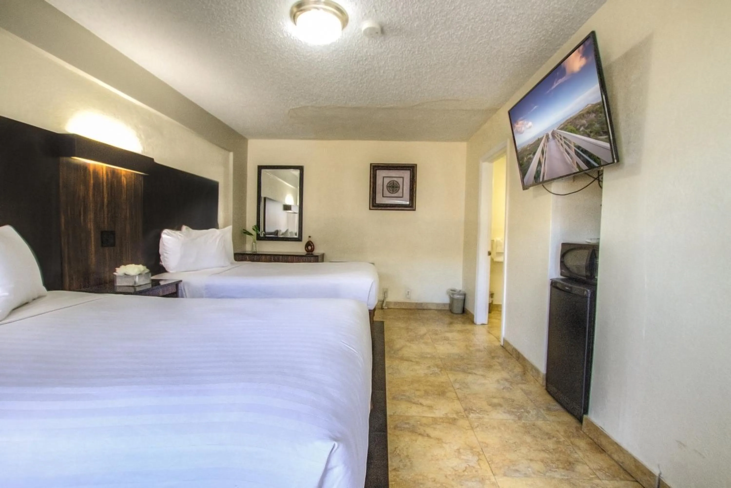 Bed in La Bella Oceanfront Inn - Daytona