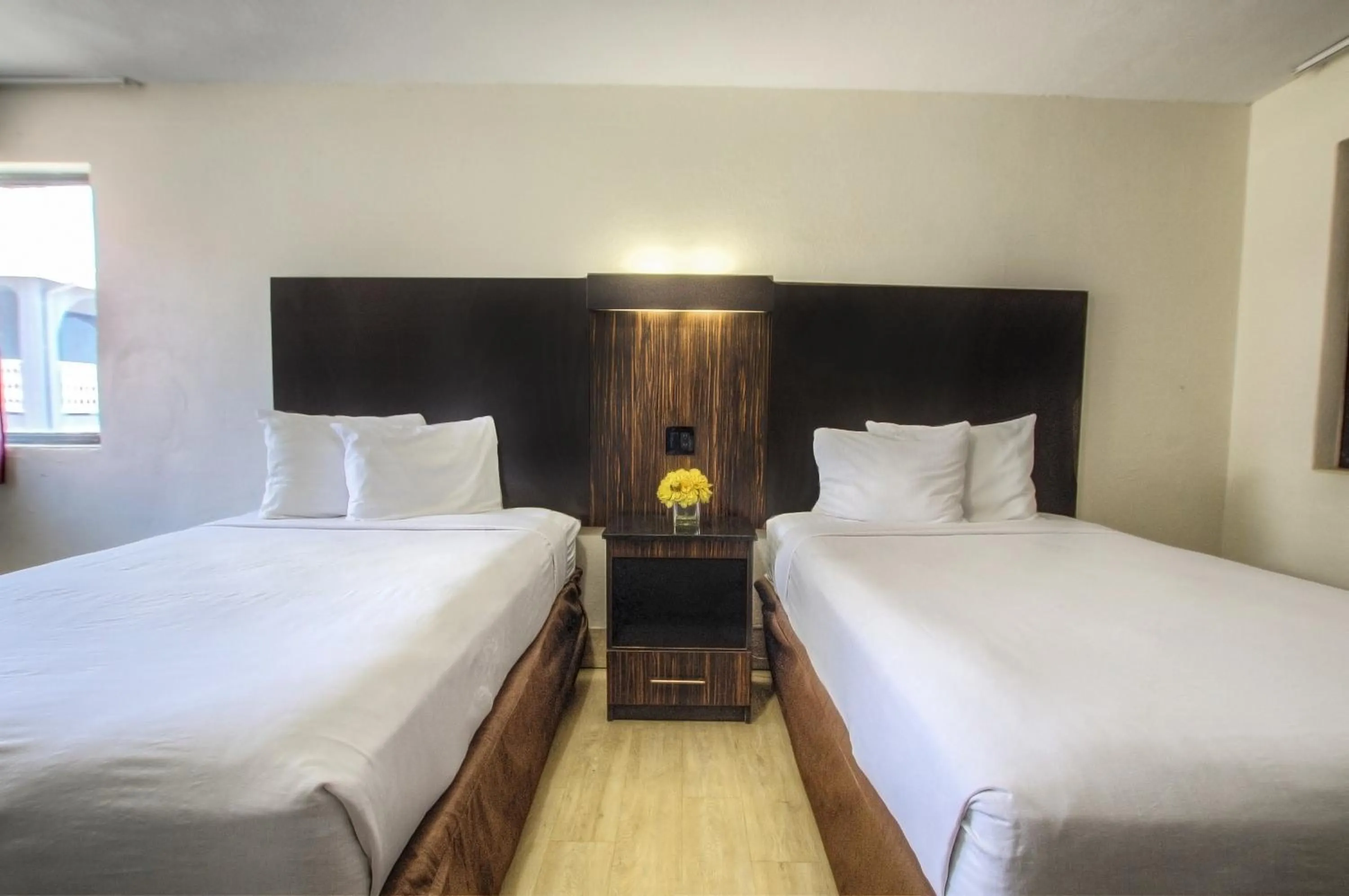 Bed in La Bella Oceanfront Inn - Daytona