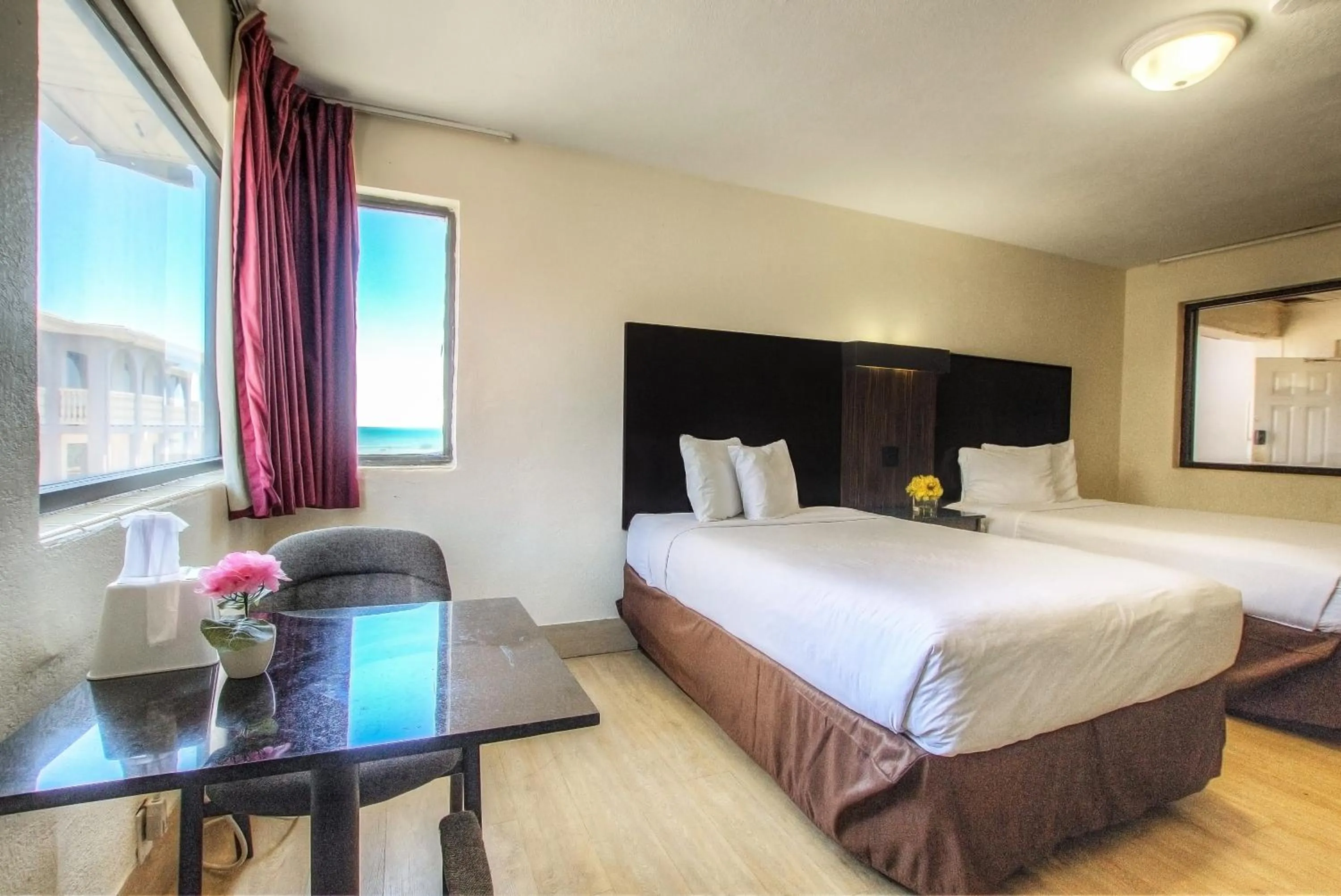 Bed in La Bella Oceanfront Inn - Daytona