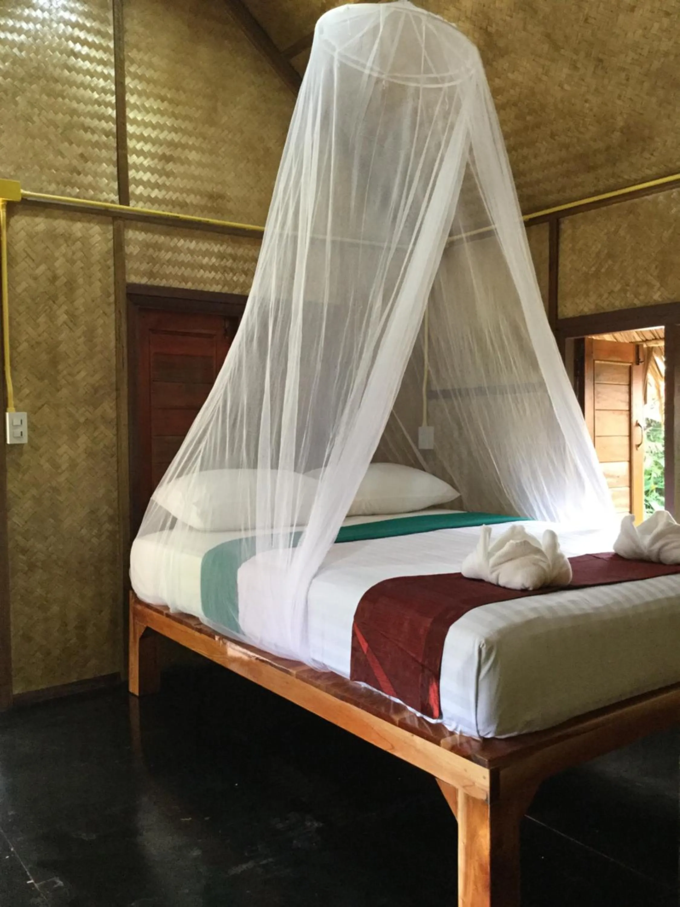 Photo of the whole room, Bed in Khaosok Bamboo Huts Resort