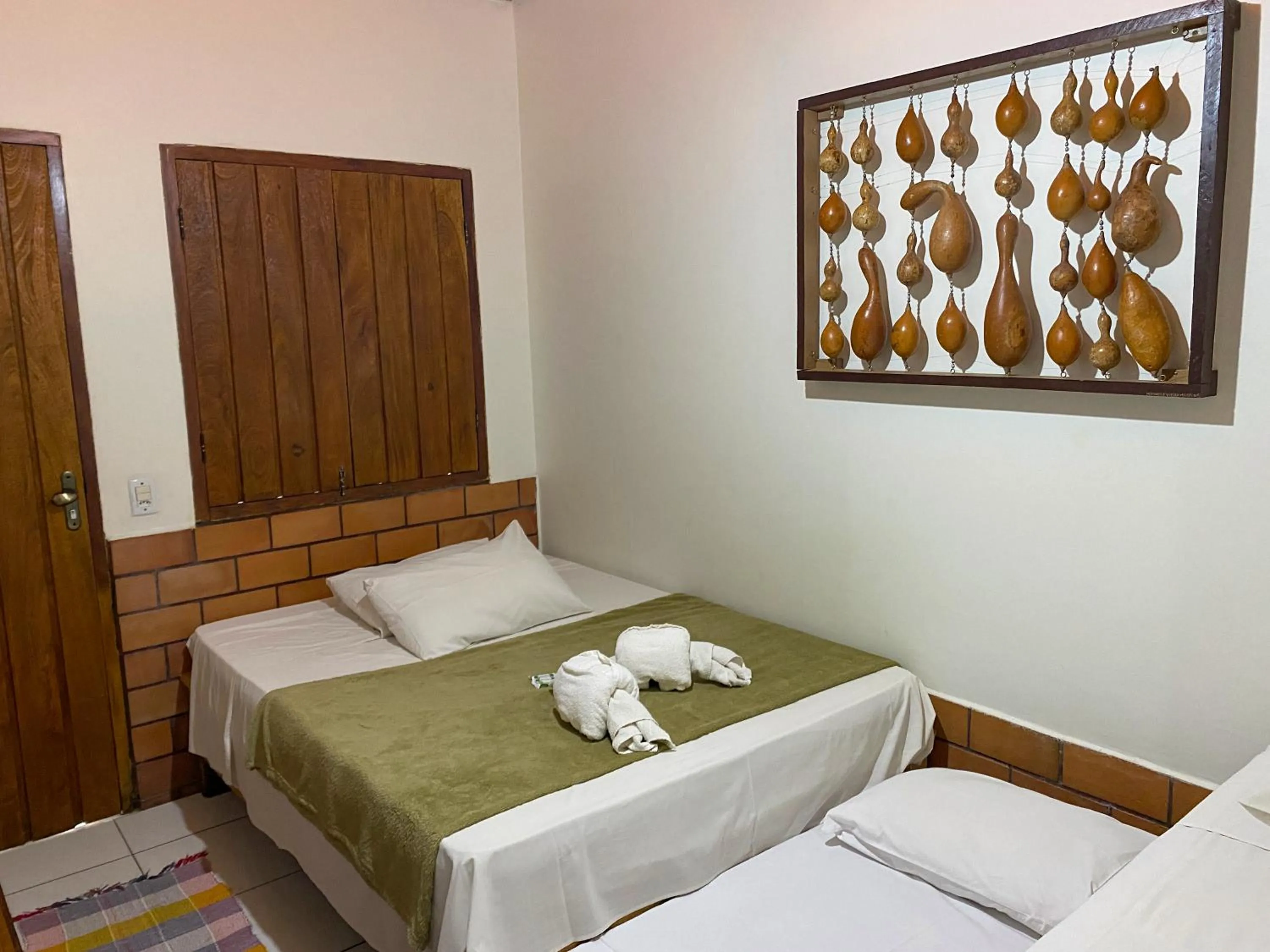 Bed in Pousada Segredo