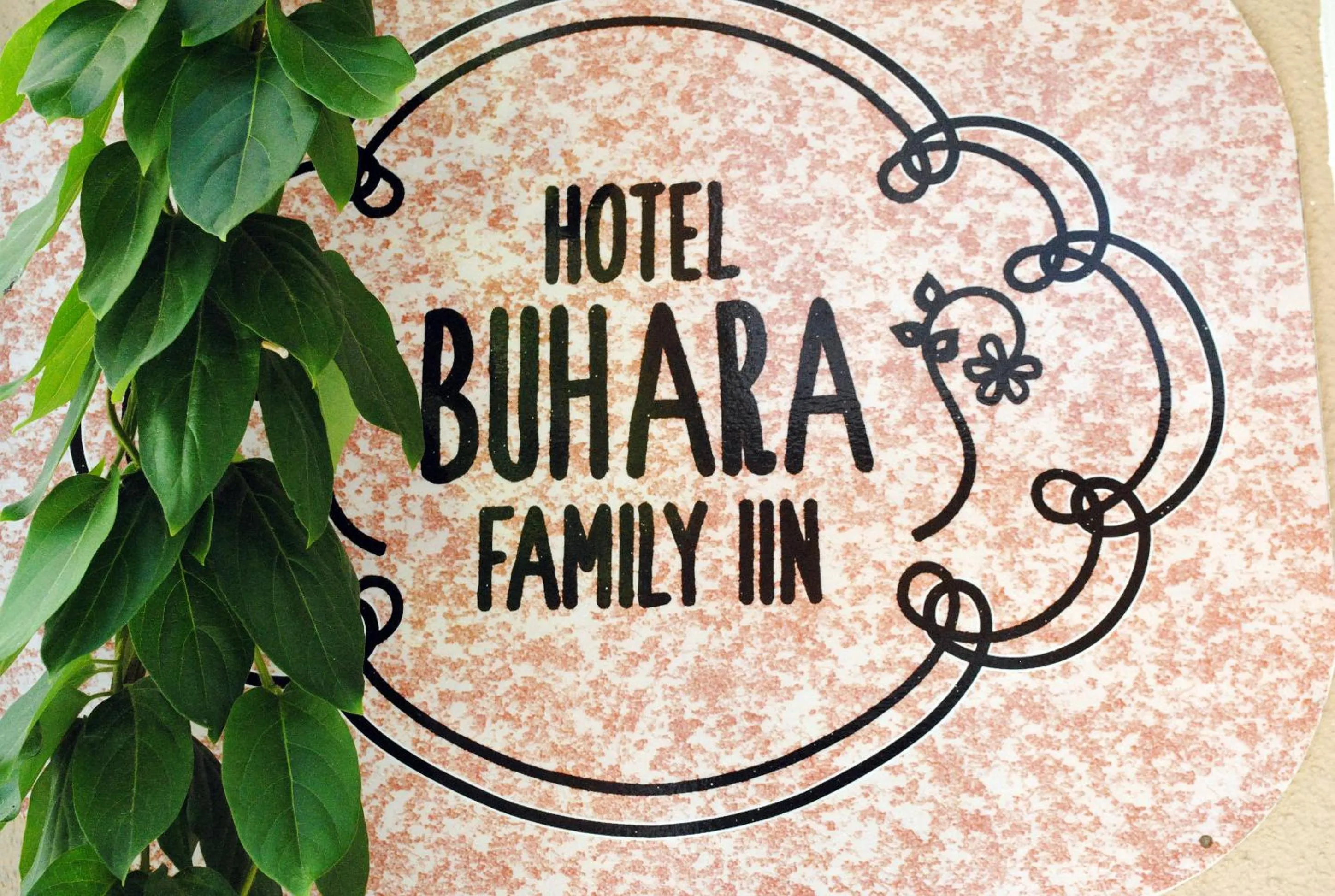 Property logo or sign in Hotel Buhara Family Inn