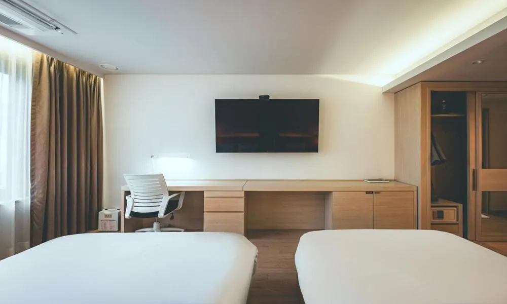 Bed in Wonju City Hotel HYEOKSIN