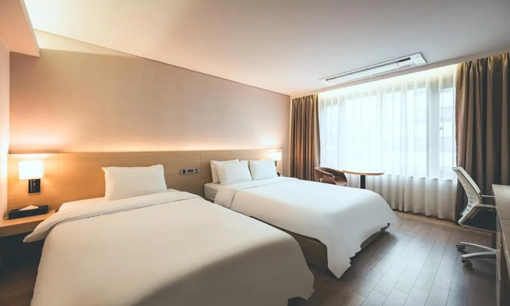 Bed in Wonju City Hotel HYEOKSIN