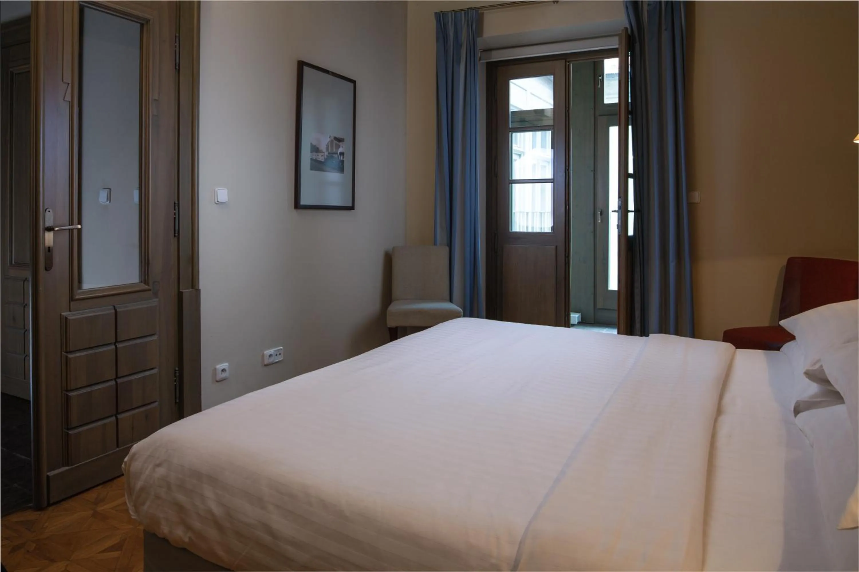 Bed in Charles Bridge Rooms & Suites by SIVEK HOTELS