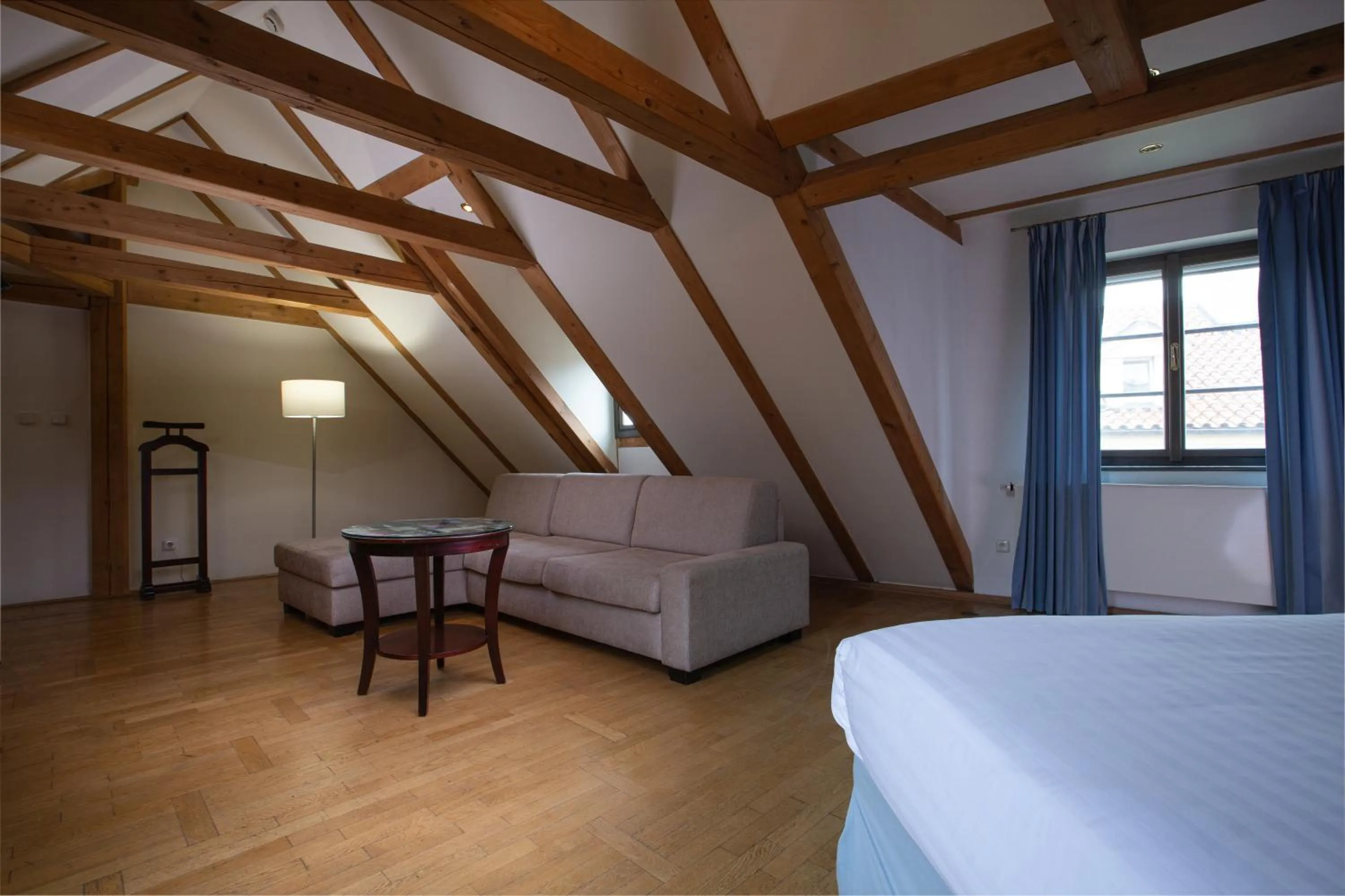 Seating area, Bed in Charles Bridge Rooms & Suites by SIVEK HOTELS