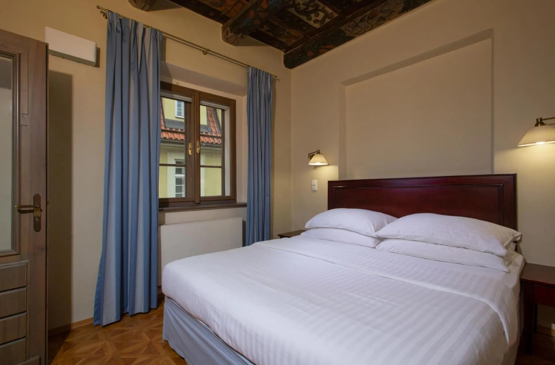 Bed in Charles Bridge Rooms & Suites by SIVEK HOTELS