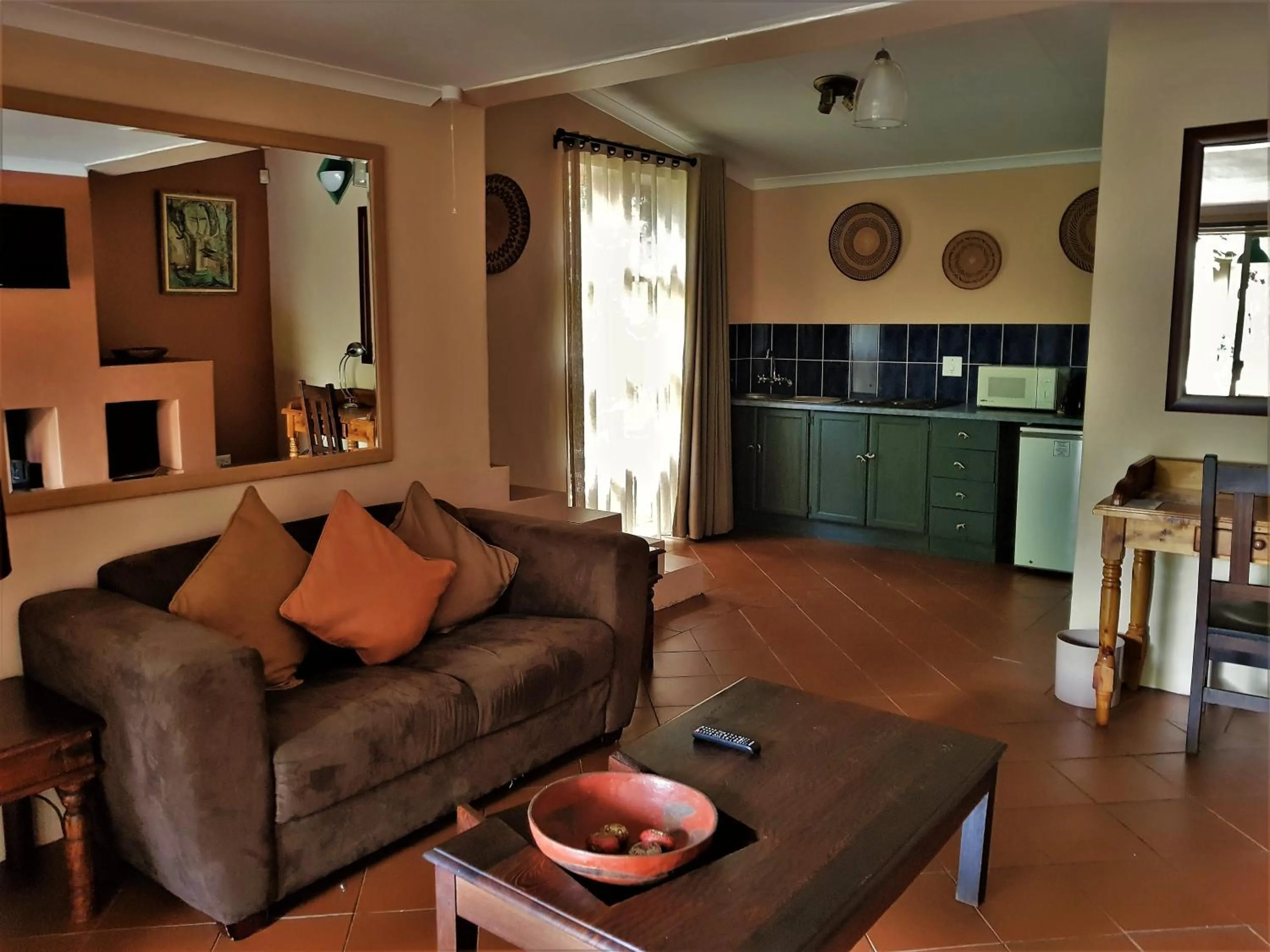 Lounge or bar in African Roots Guest House