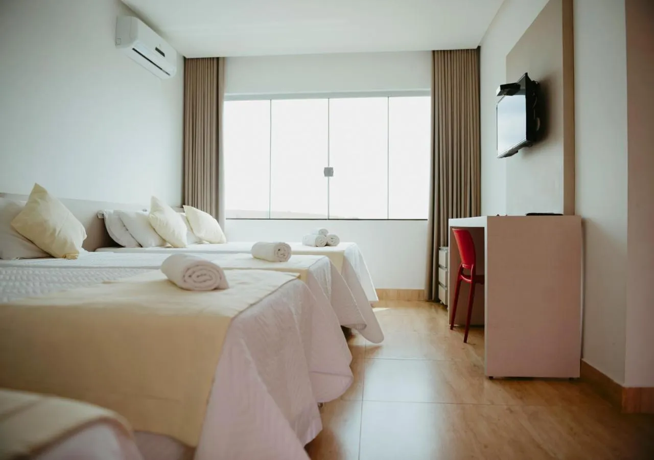 Communal lounge/ TV room, Bed in Hotel Chalé Capitólio