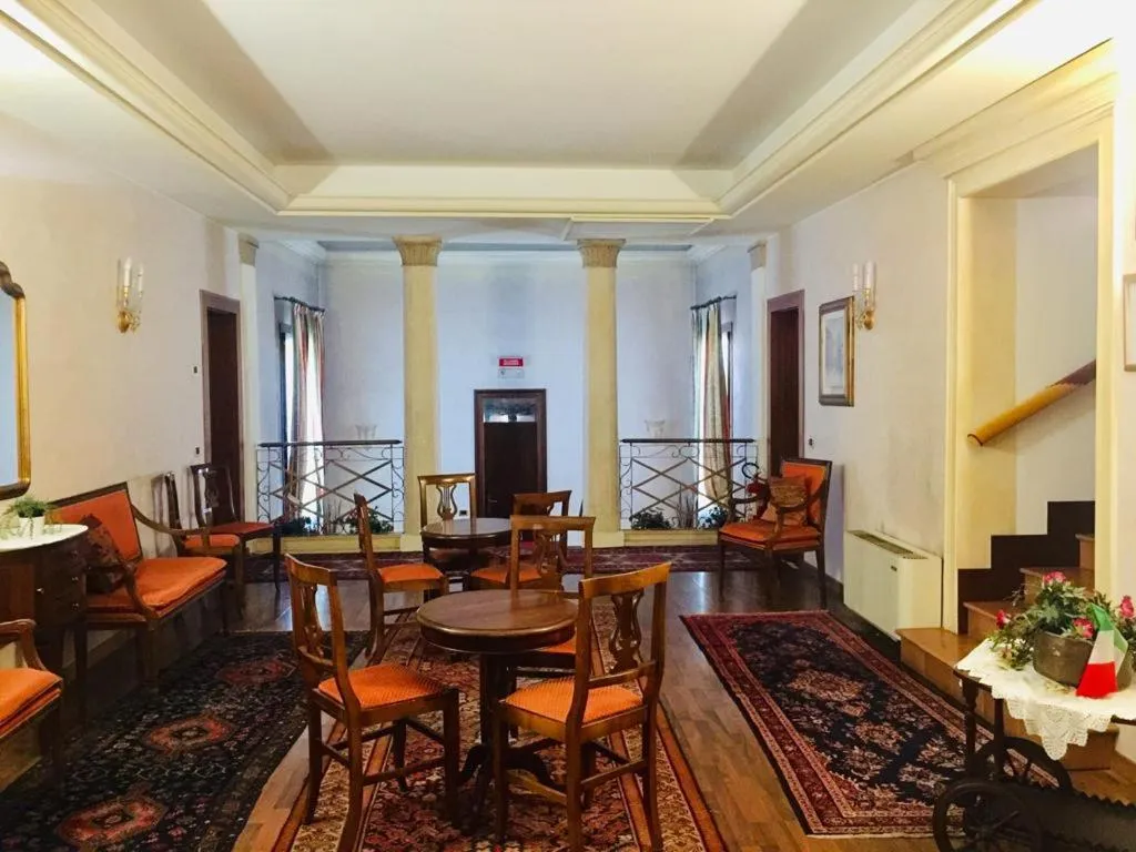 Communal lounge/ TV room in Hotel La Loggia