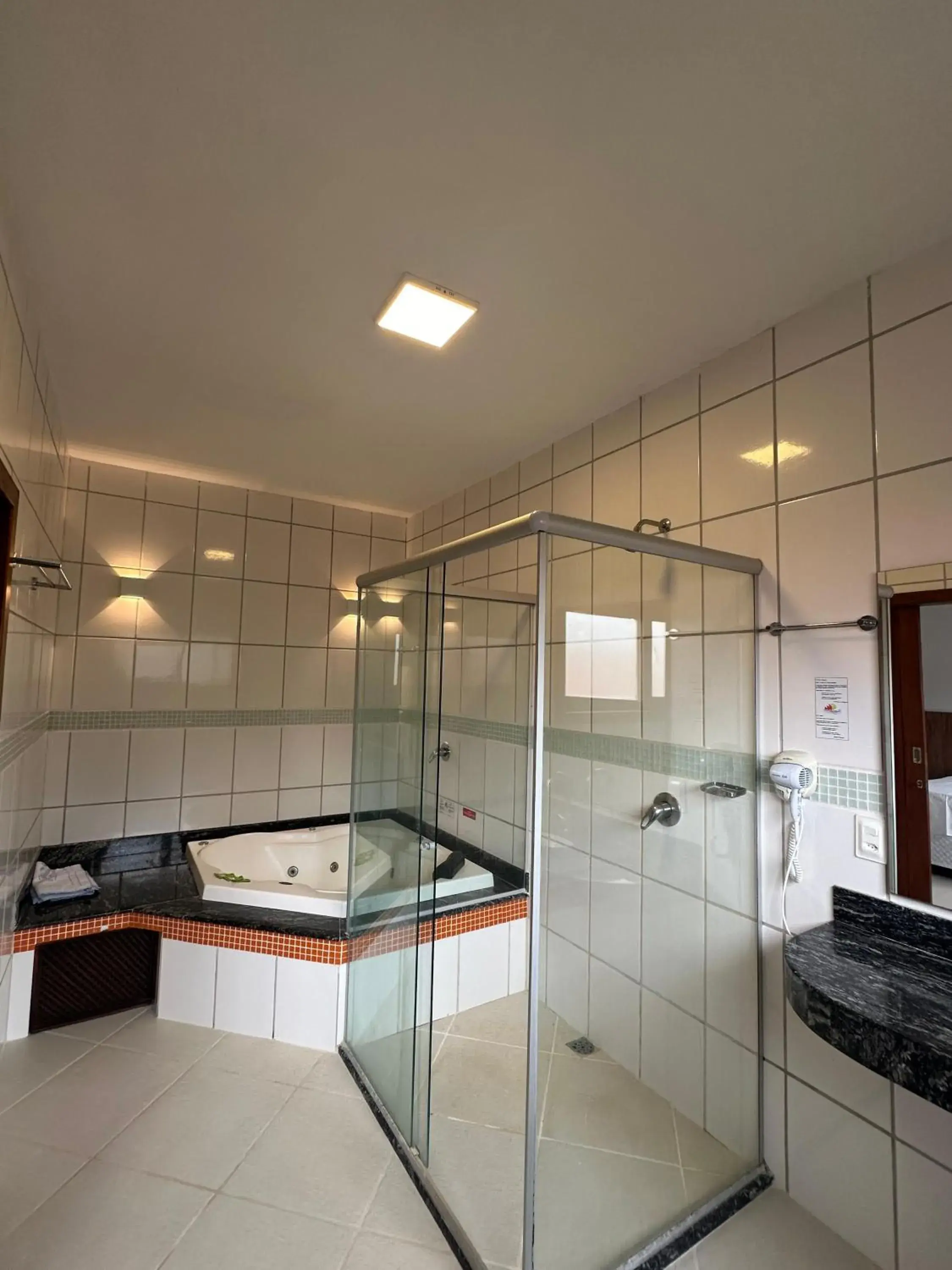 Deluxe Suite with Spa Bath in Pousada Porto da Barra Deluxe Suite with Spa Bath in Pousada Porto da Barra