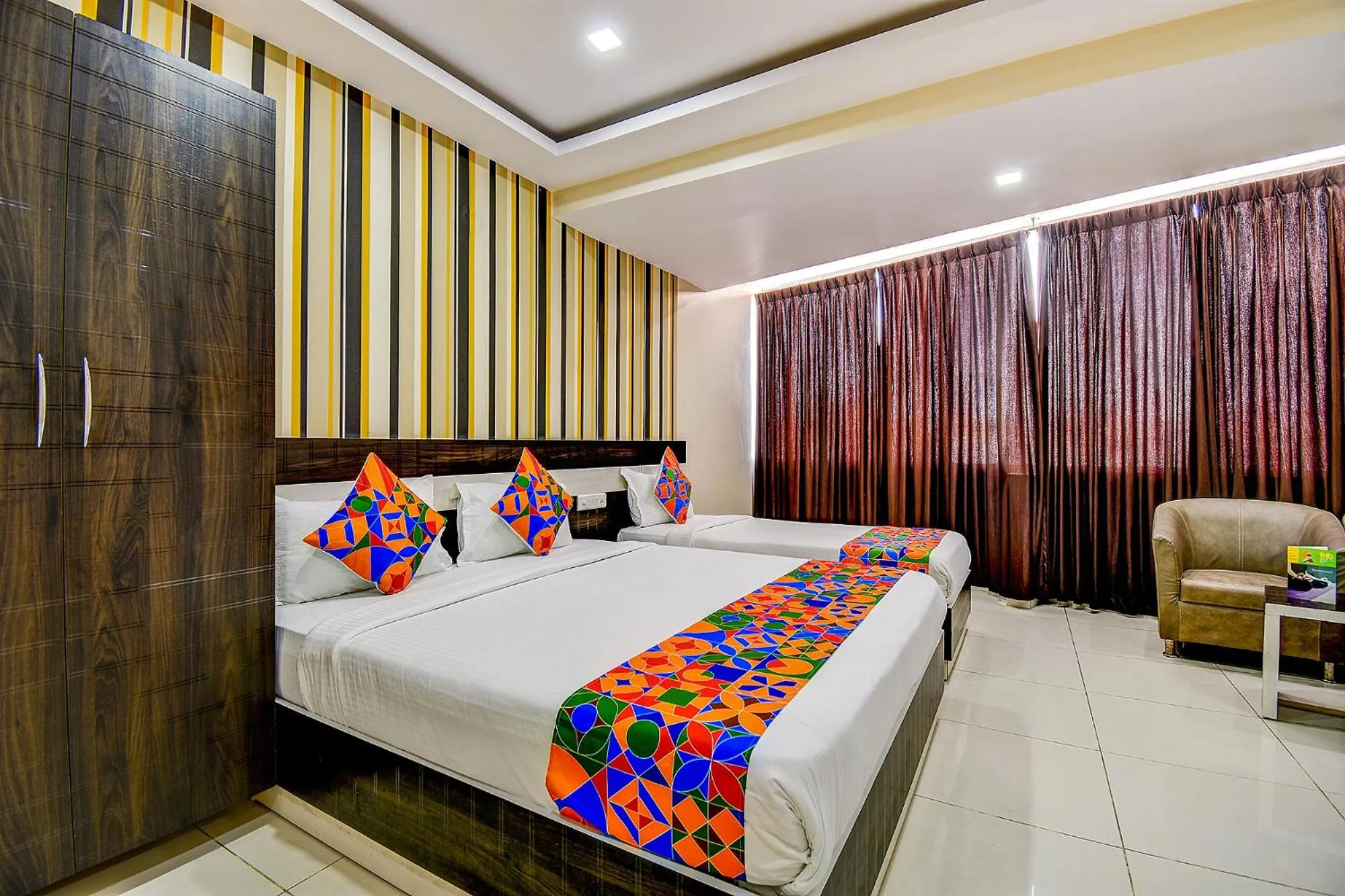 Bed in FabHotel Rotano Suites - Yelahanka