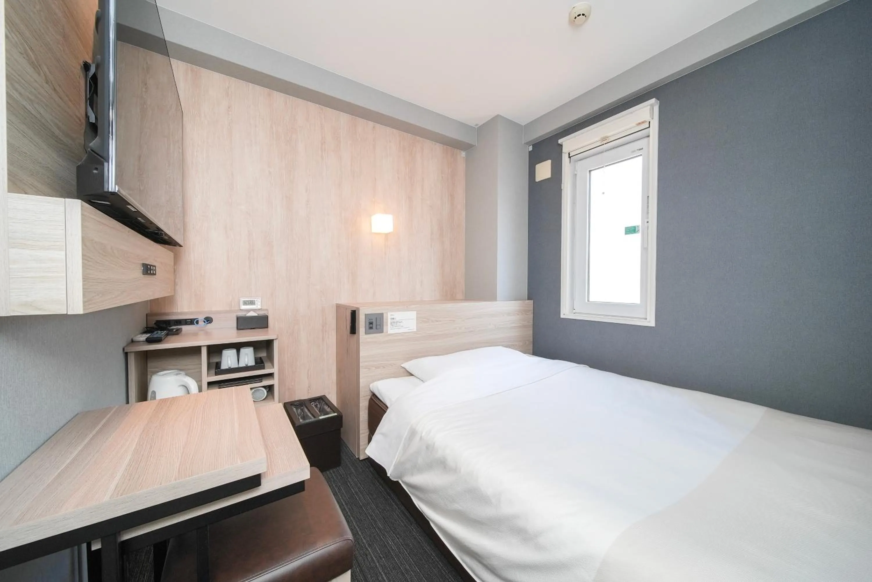 Bed in Super Hotel Hiroshima