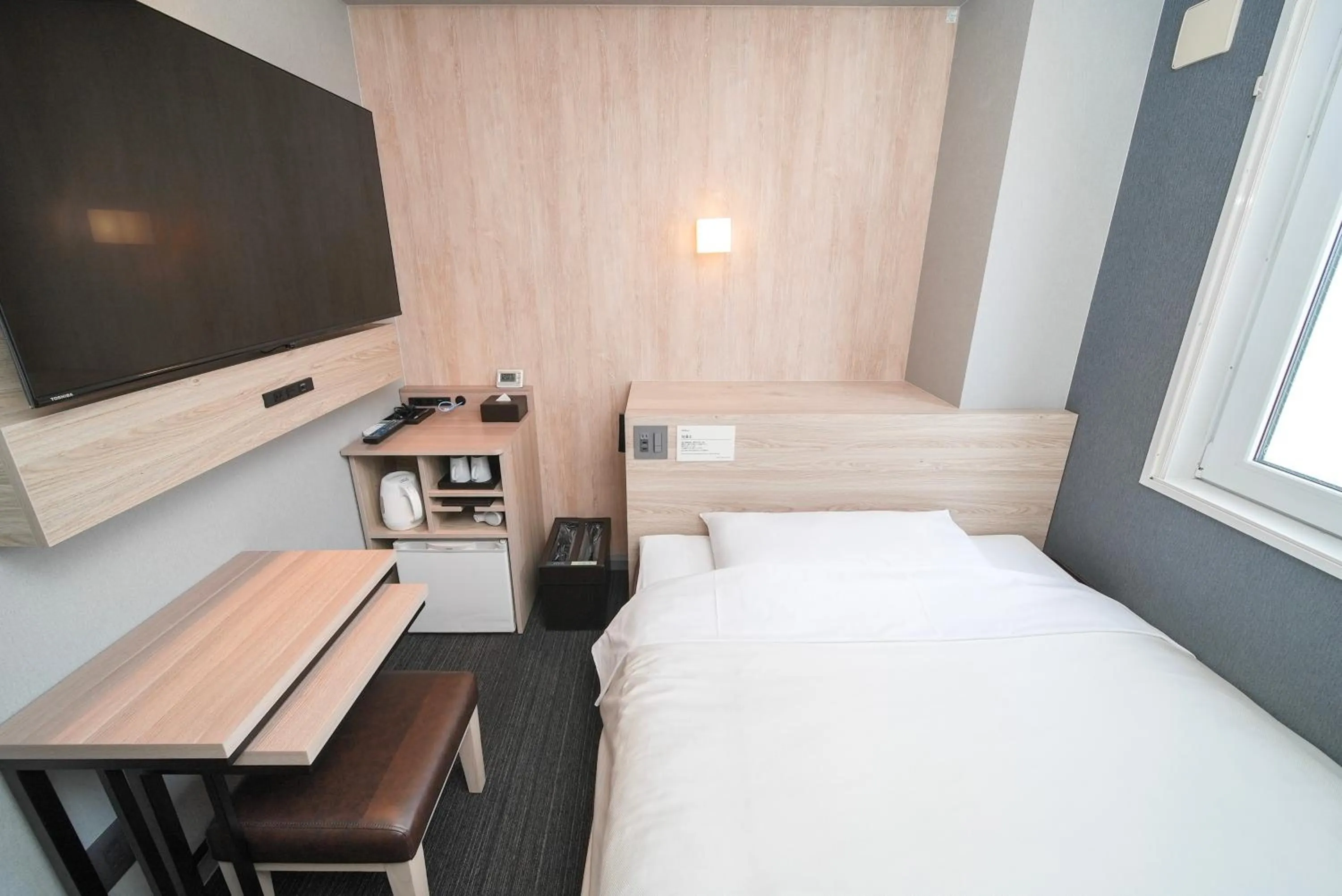 Bed in Super Hotel Hiroshima